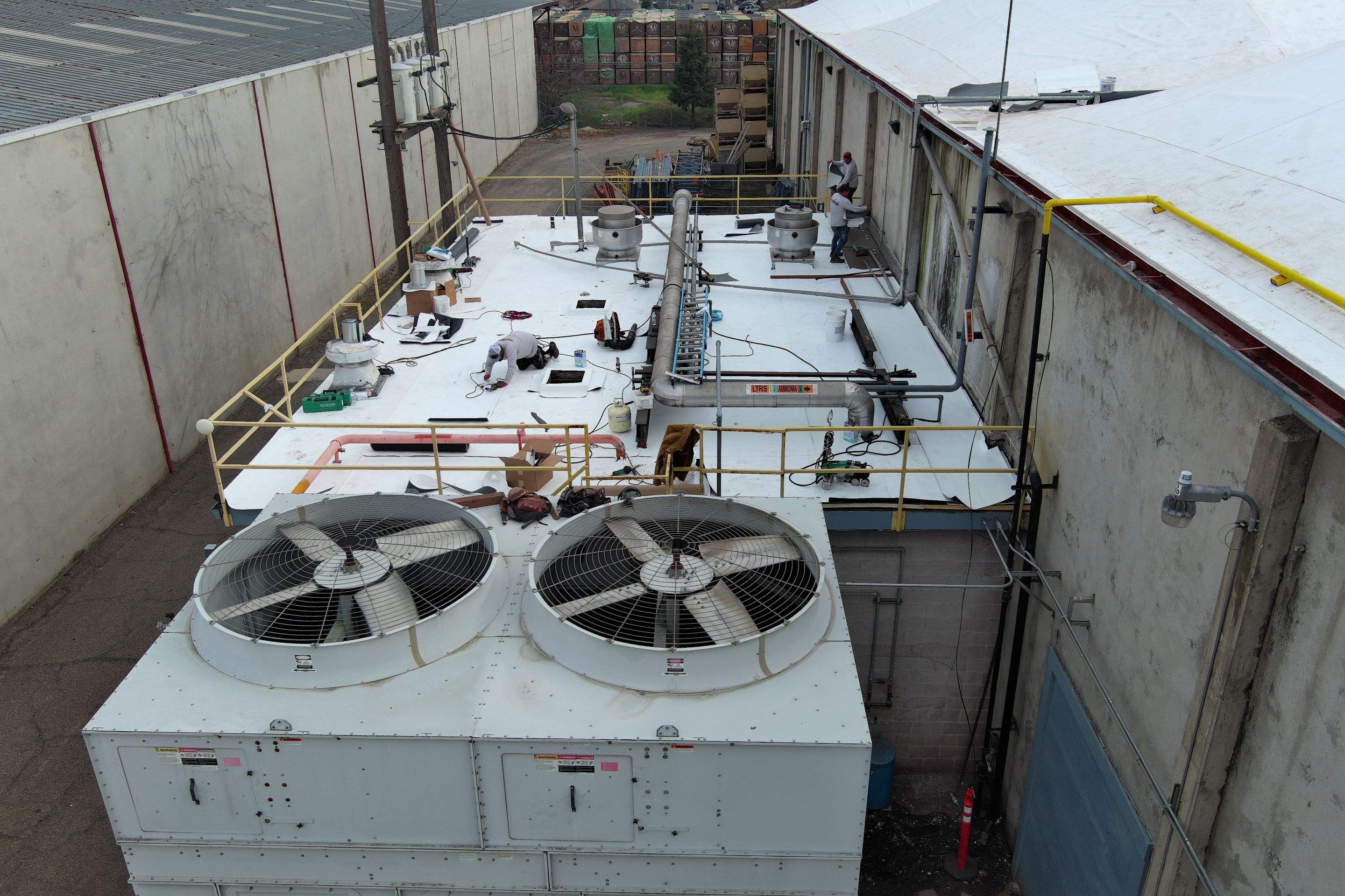 TPO single-ply roofing system using GAF Single-ply TPO 60 mil with 1.5 inch ISO board insulation by Straight Edge Roofing Inc