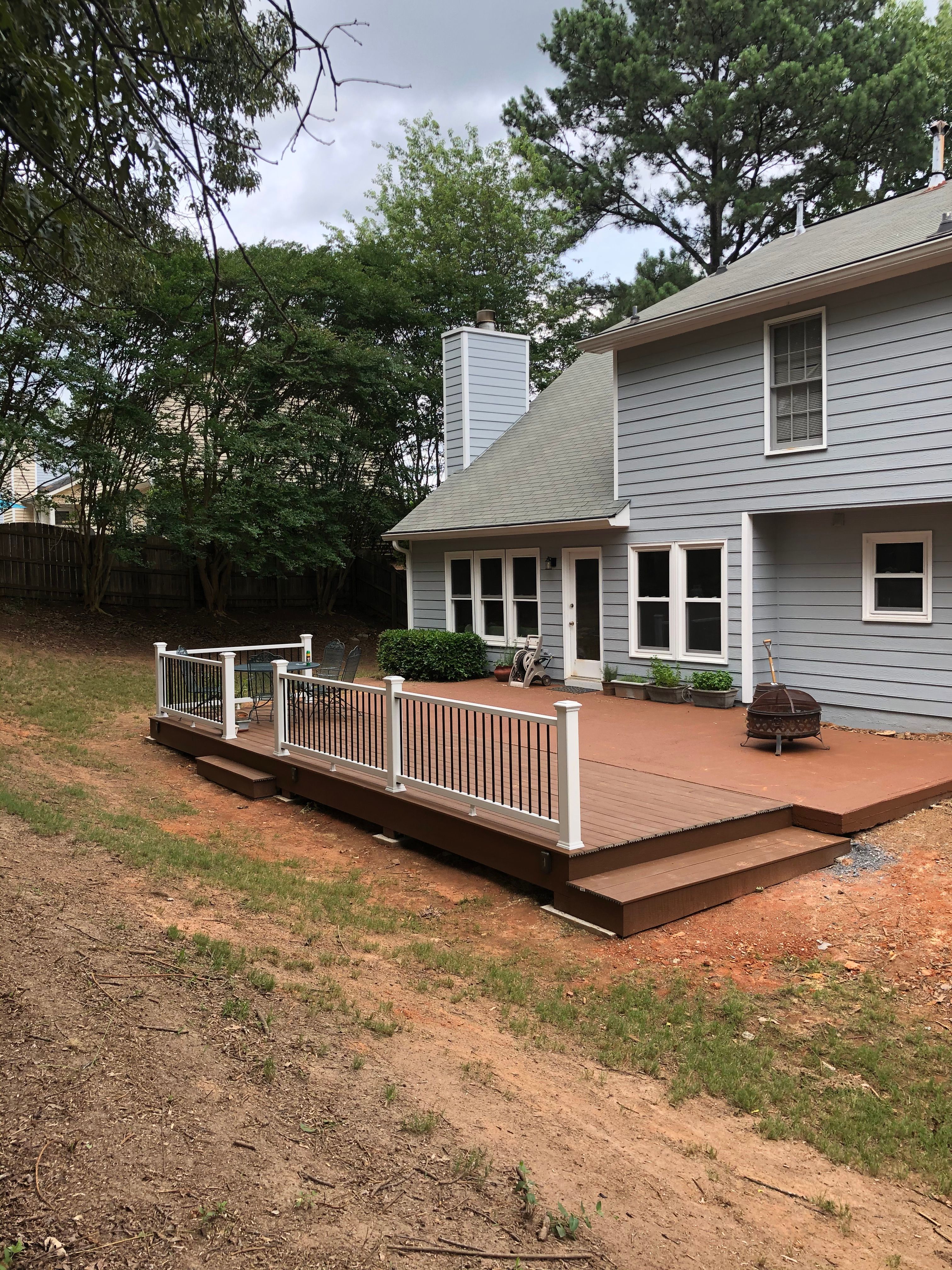 Composite Deck Replacement with White Railings in Duluth by Swift Home Renovations