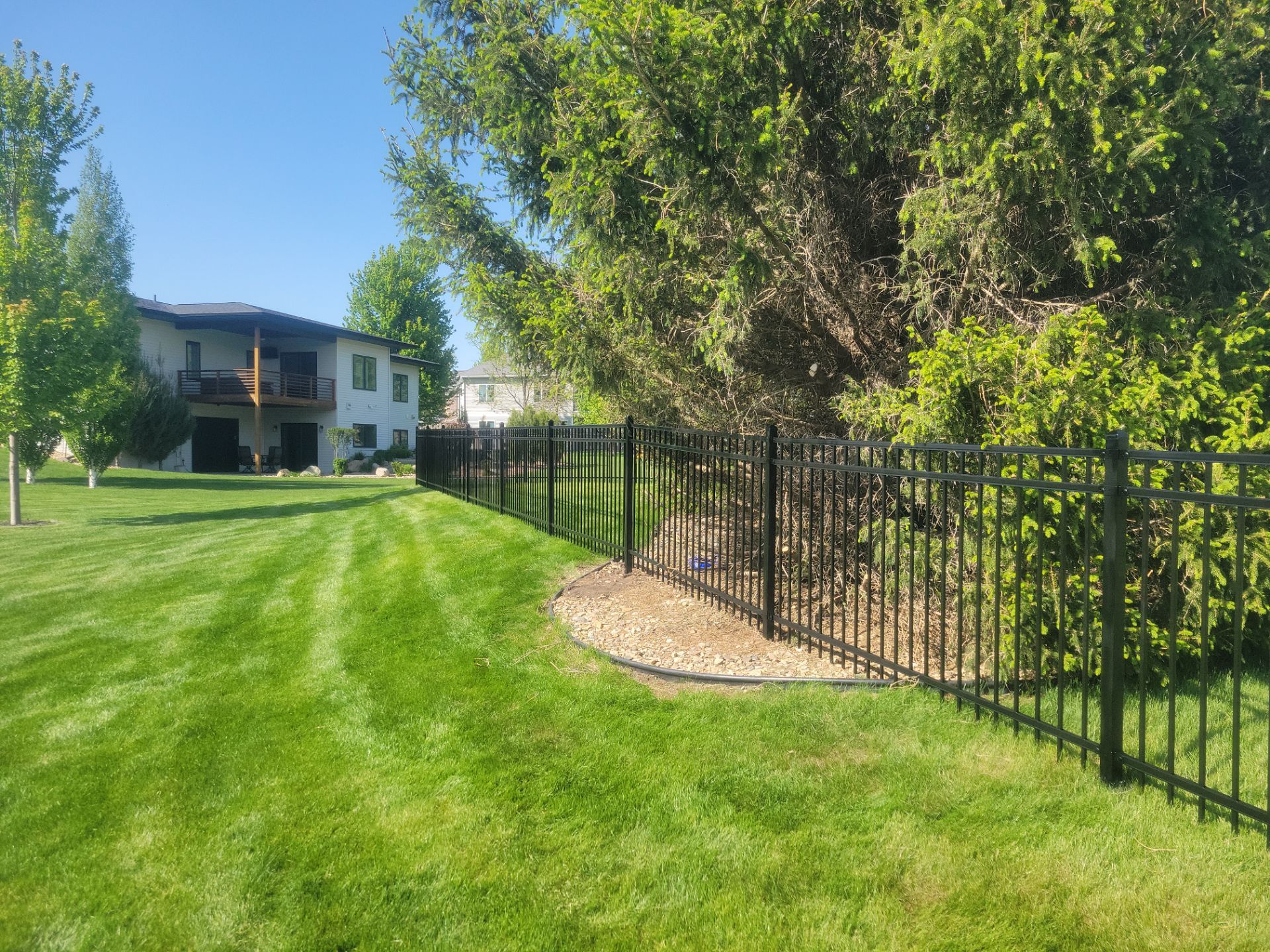 Black Ornamental Metal Picket Fence Installation in Waterloo by Perfect Picket Fence and Stain