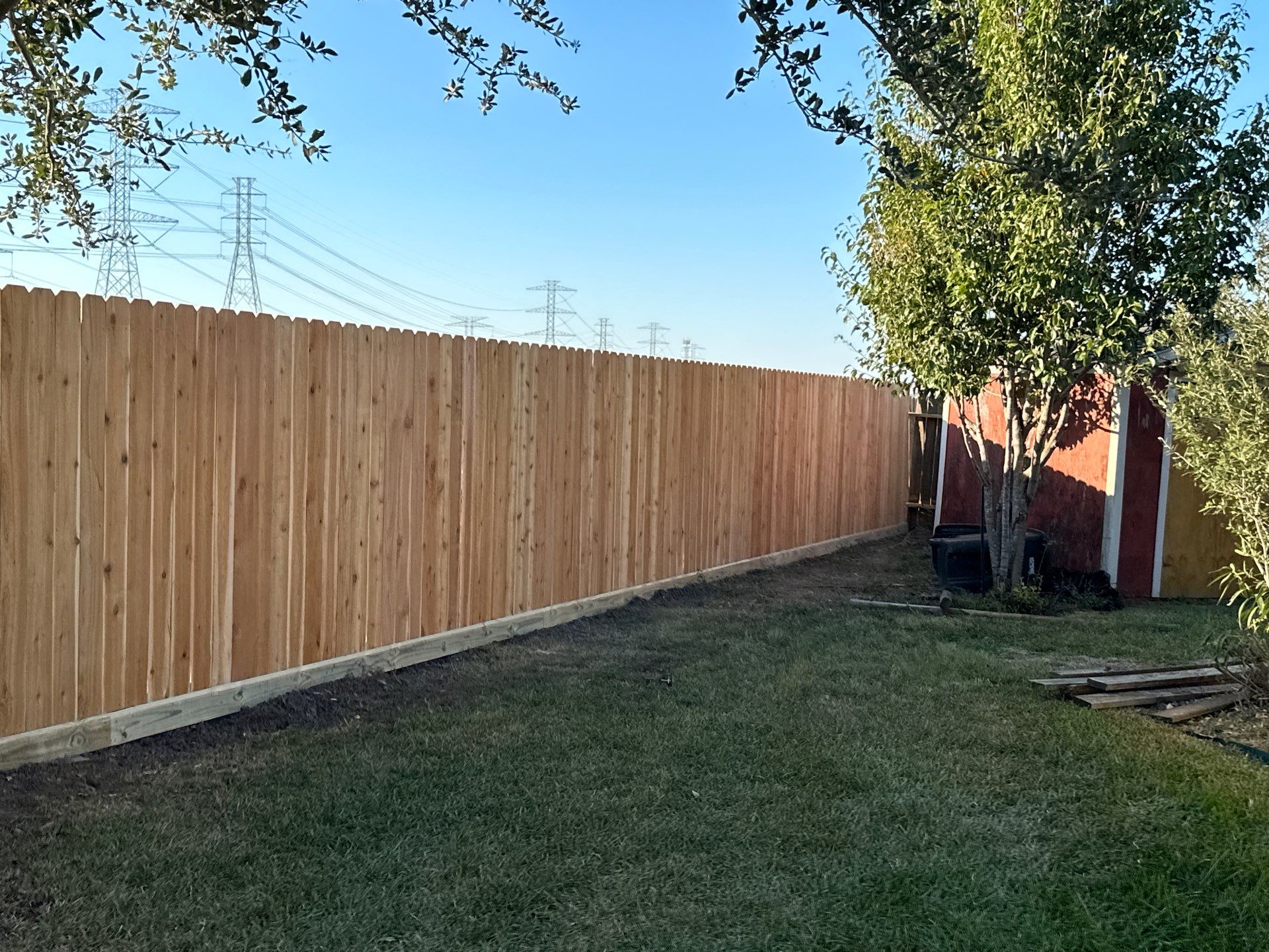 Beautiful Wood fence with metal posts by Tim's Fences