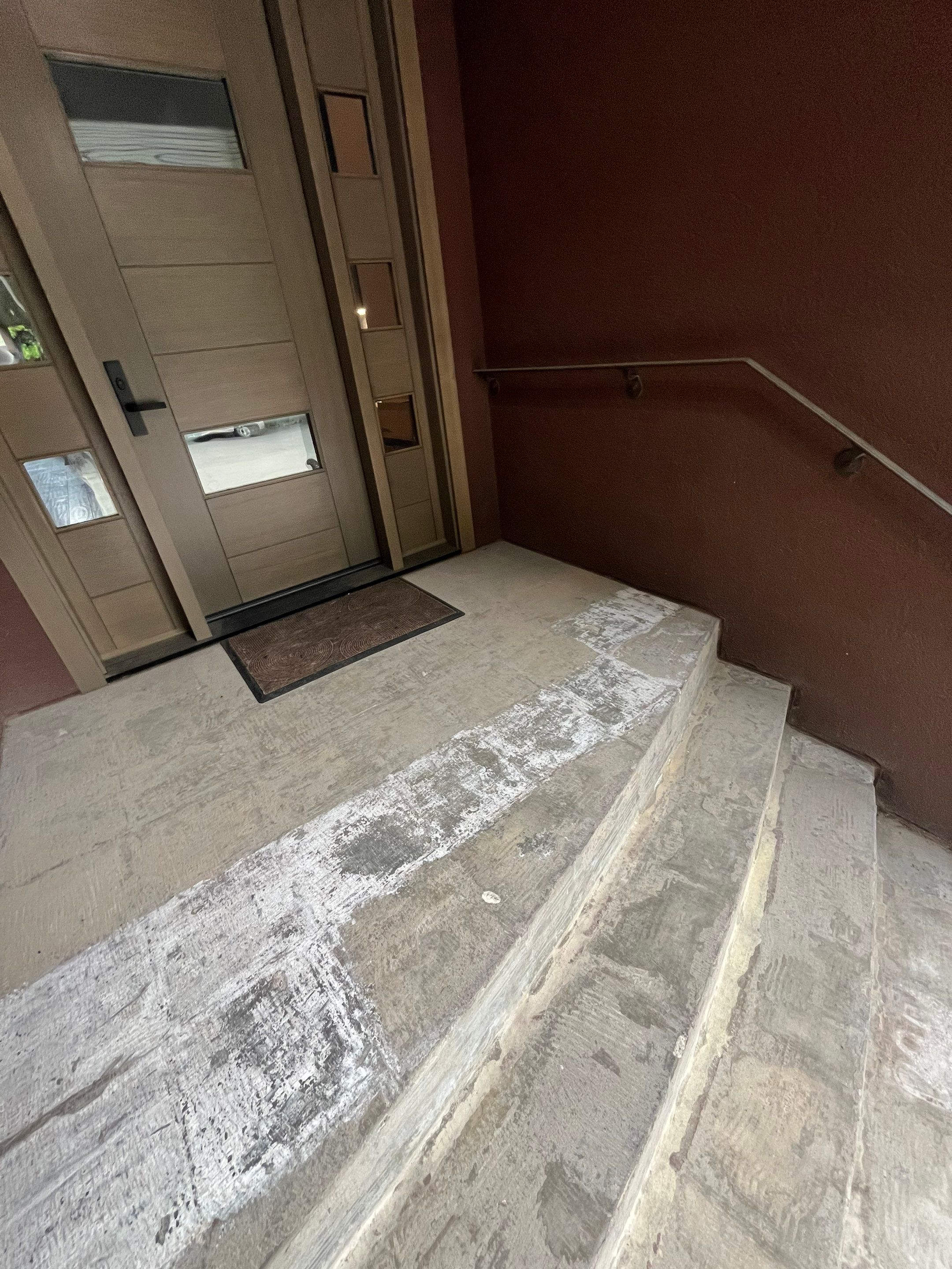 Garage Floor and Entry Step Concrete Coating in Sioux Falls by Select Painting, Coatings & Garage Cabinets