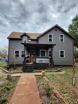 Royal Granite Siding Replacement & Brown Seamless Gutters
