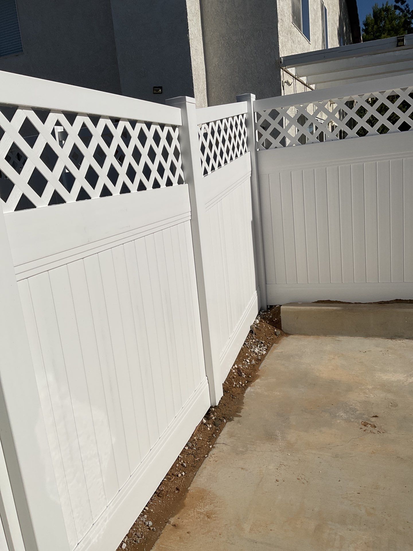 Lattice Vinyl with Privacy Vinyl Fence by Fence Guys Inc.