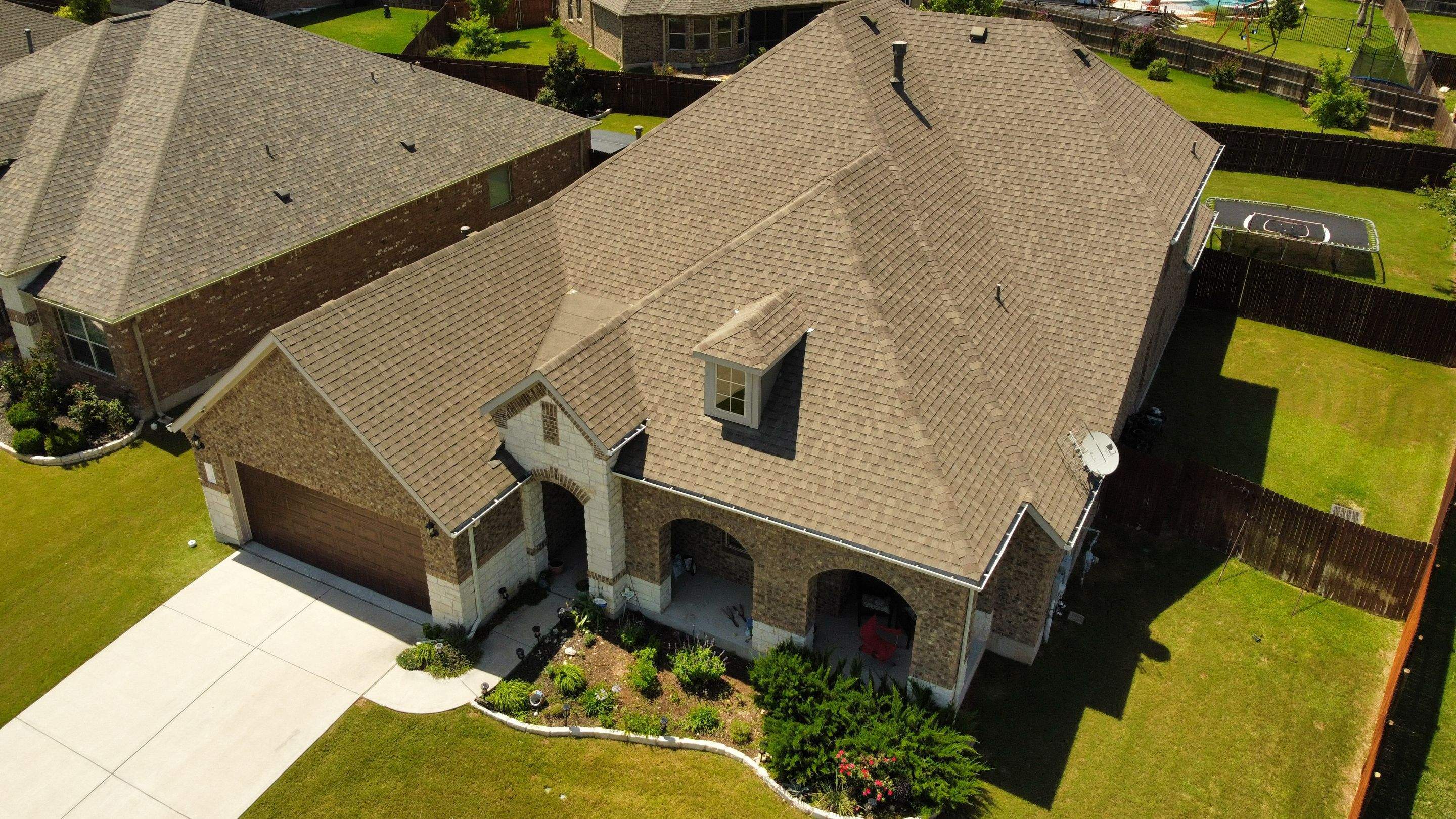 Full Roofing Replacement and Cedar Privacy Fence Installation in Leander by Caliber Restoration LLC