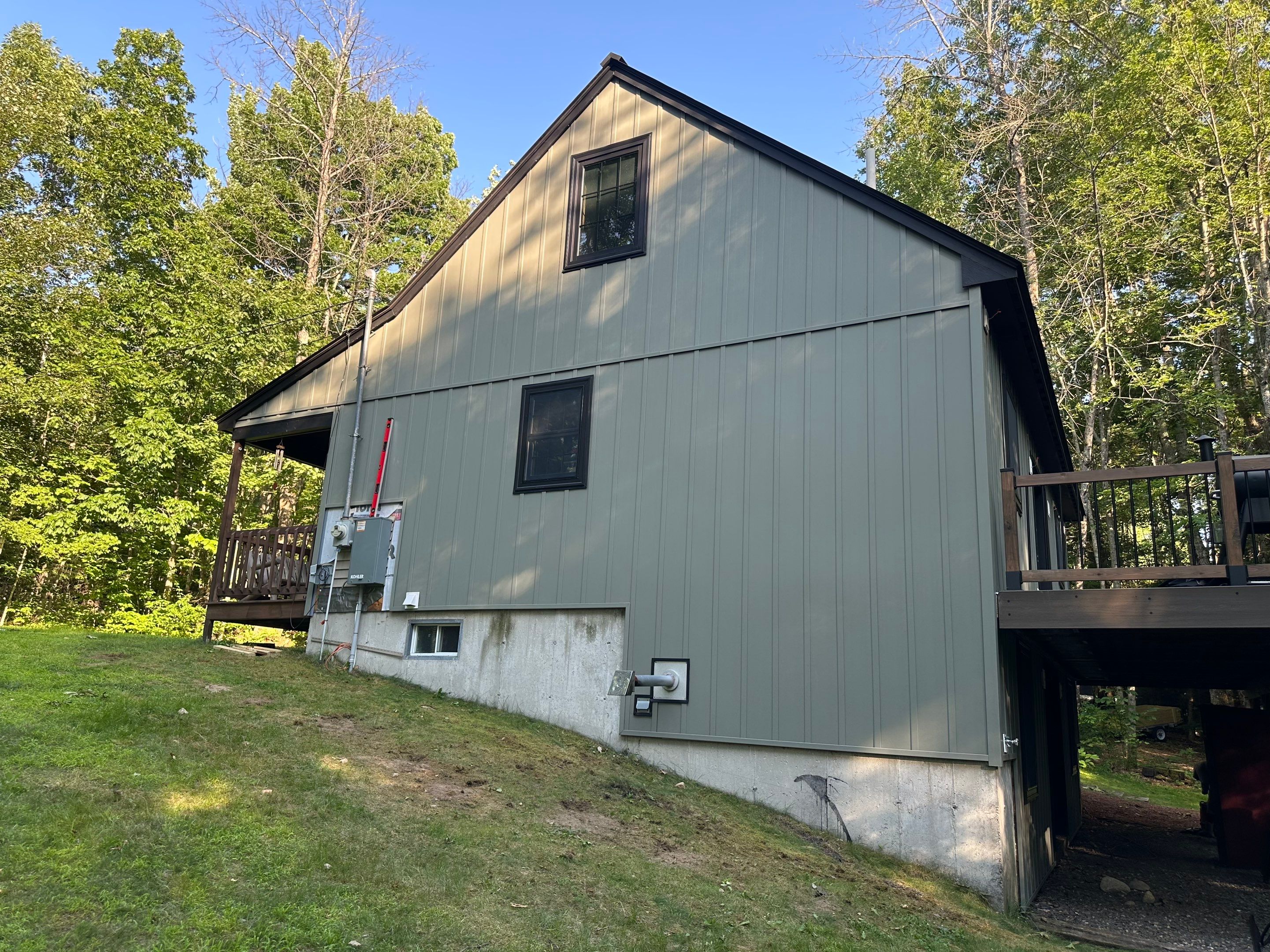 Sage Green Board and Batten Siding and Deck Upgrade in Standish by Tall pine roofing