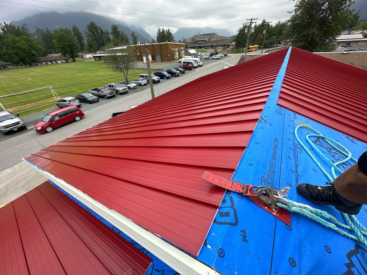 Commercial Roofing Installation using 12" Prolok metal by Top Notch Roofing Inc