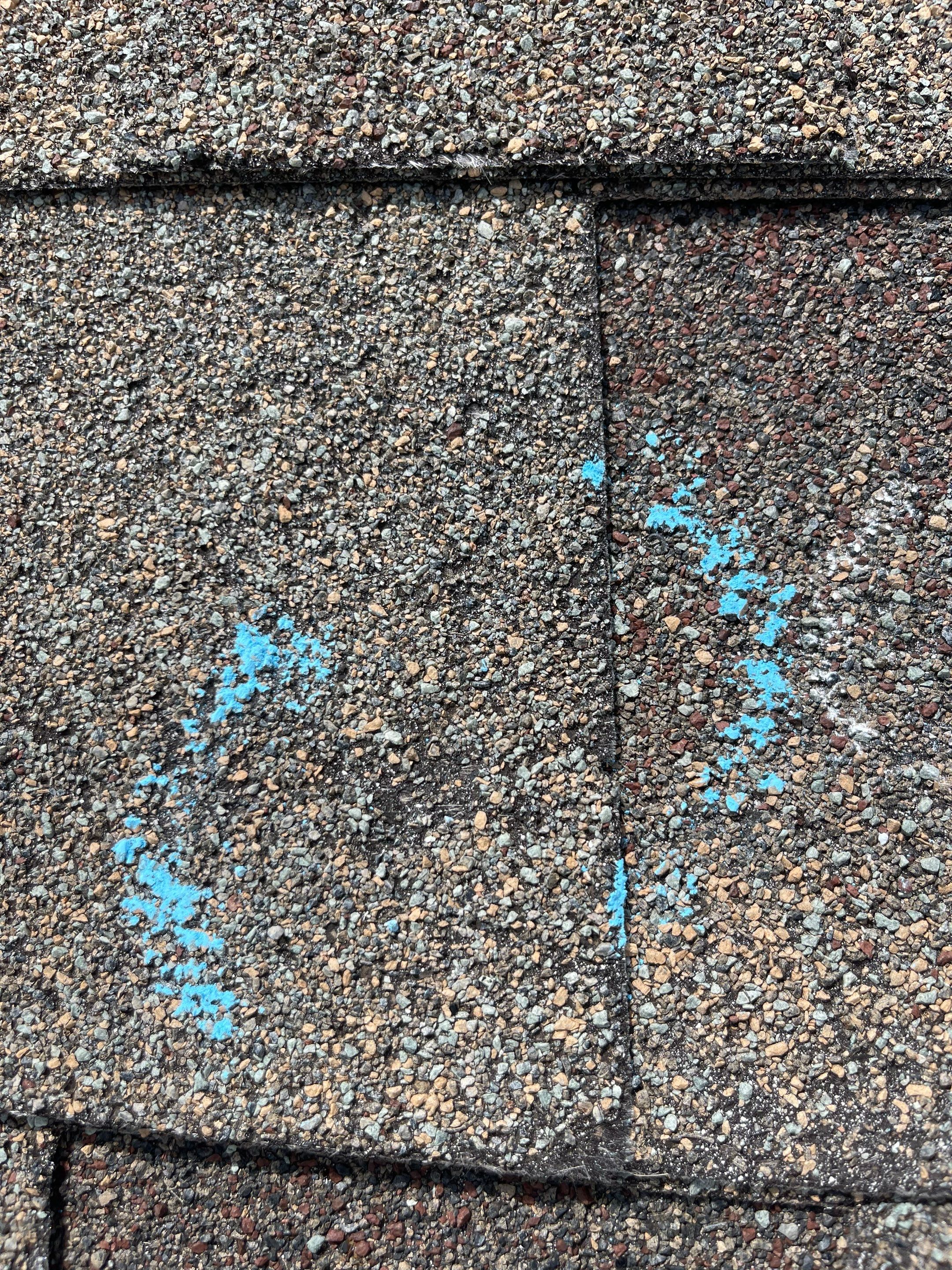 Hail Damage on a Roofing System by Icon Roofing And Construction 