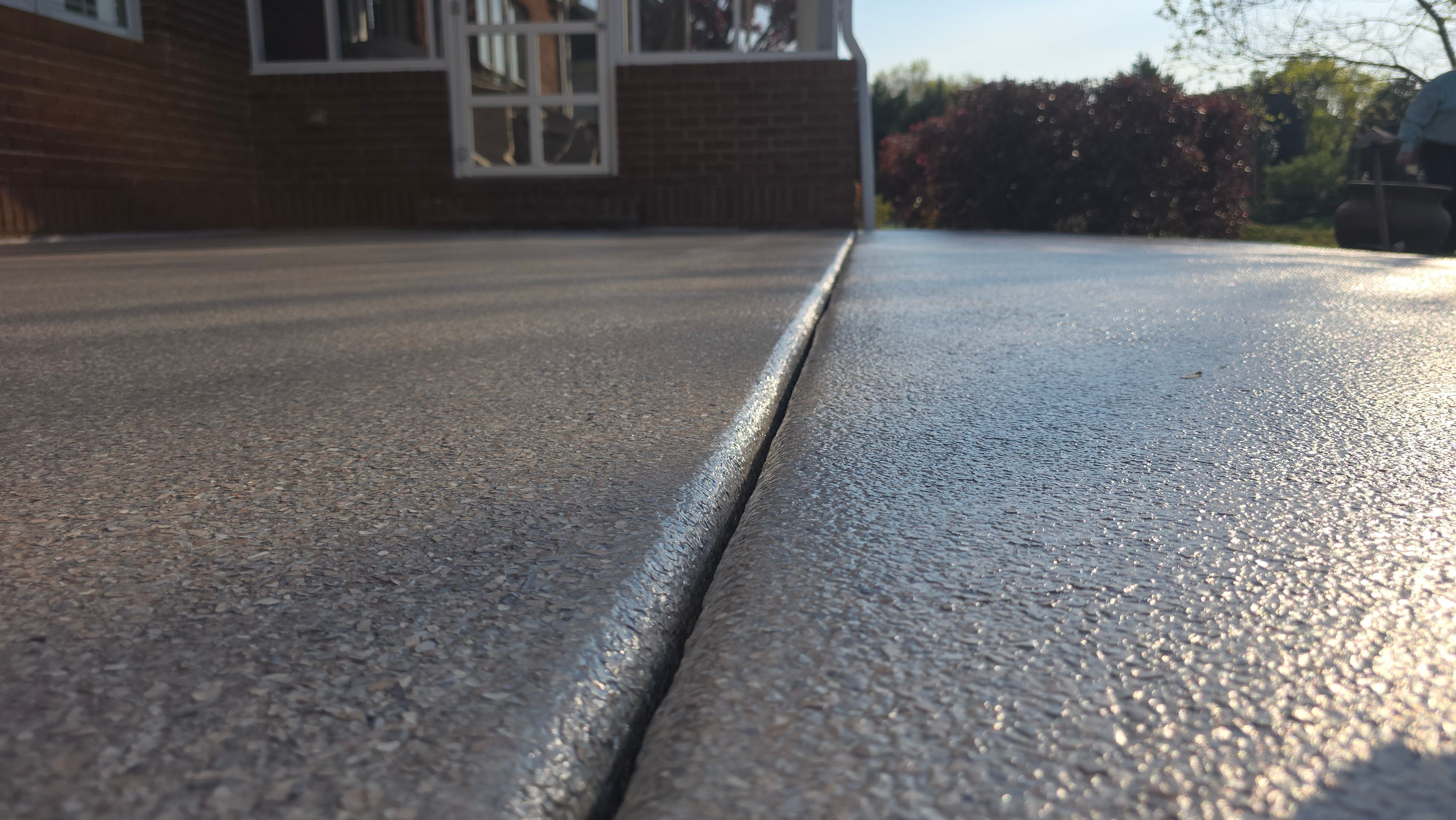 Patio in Pumice with Obsidian Border  by Elite Floor Solutions