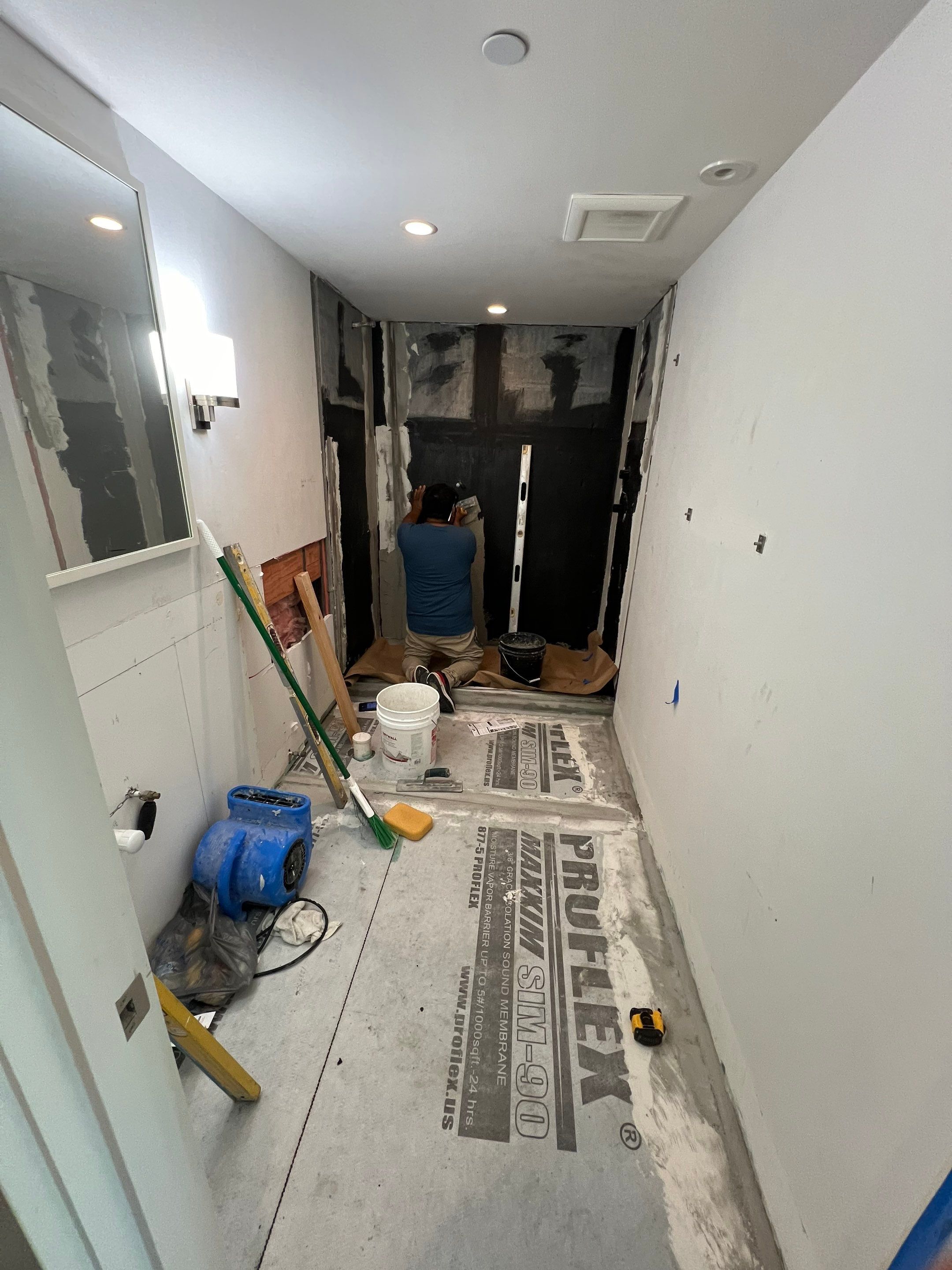 High-Rise Bathroom Remodel by Naples Flooring Boutique