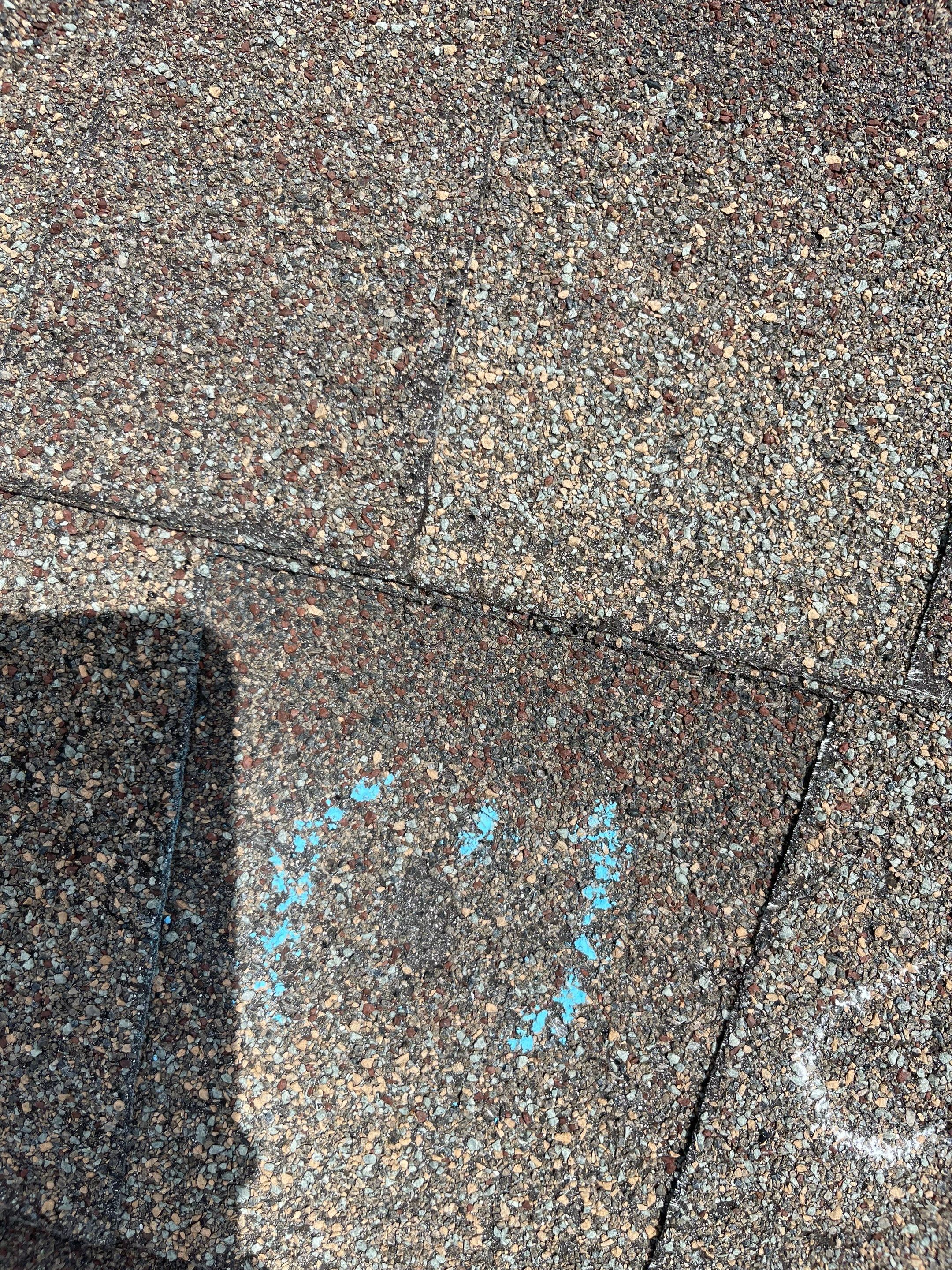 Hail Damage on a Roofing System by Icon Roofing And Construction 