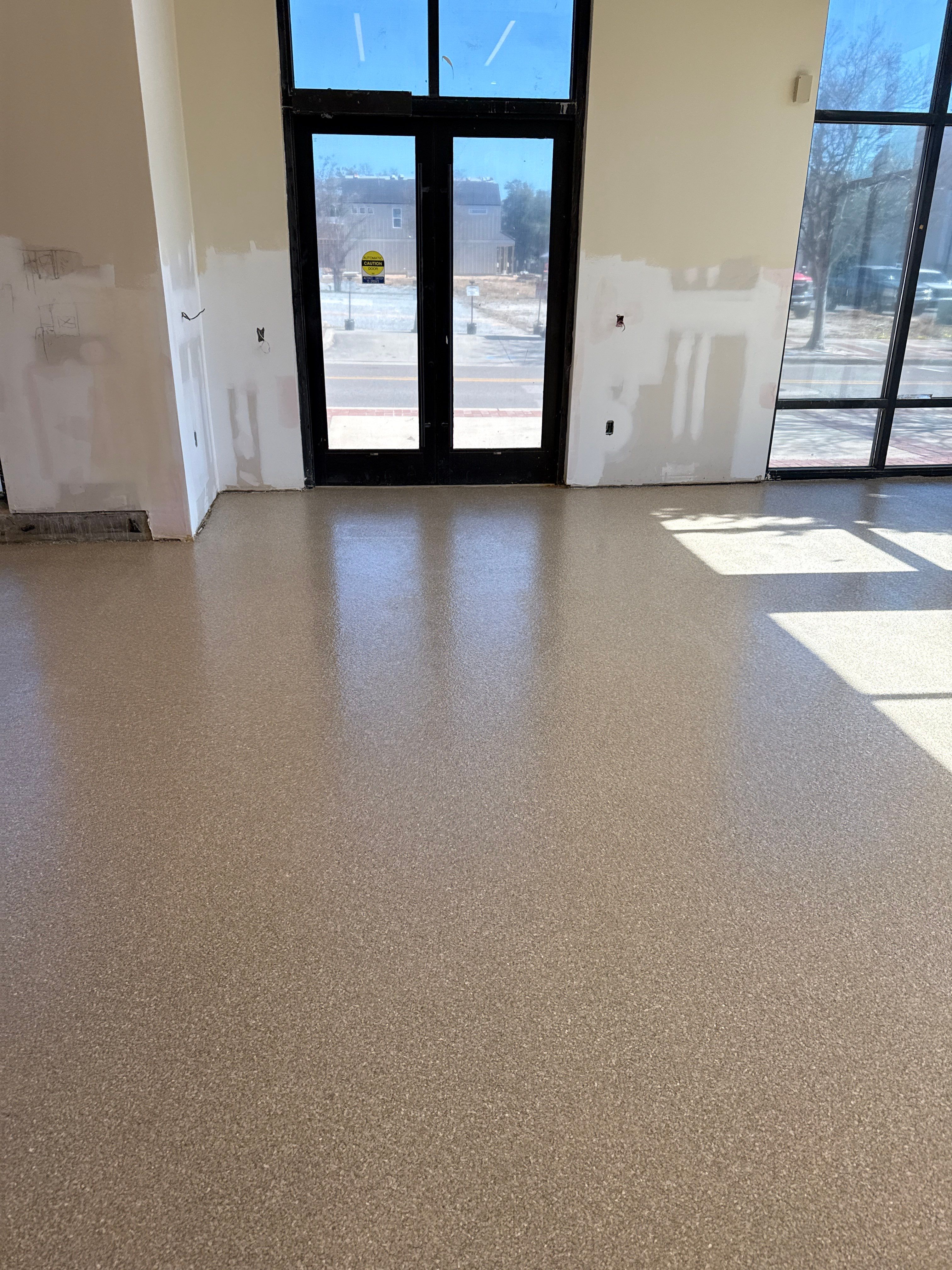 Industrial Epoxy Flake and Concrete Overlay Floor Installation in Pensacola by Cornerstone Hard Surface Restoration