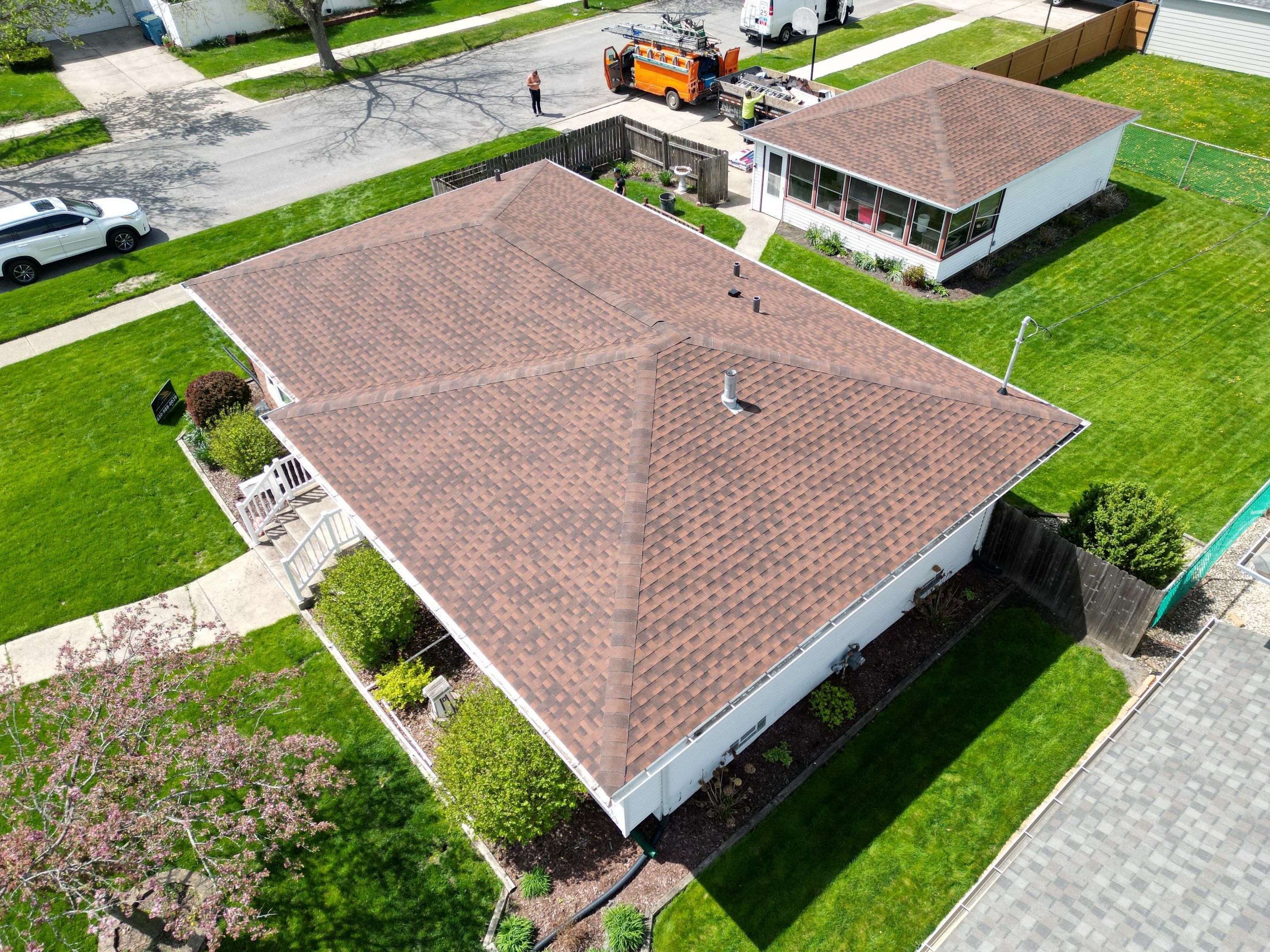 House and garage roof replacement by Optimal Home Improvement 