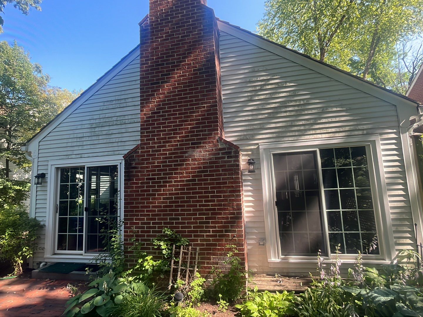 Housewashing  using Algaecide, soft wash soap by Northern Power Washing LLC.