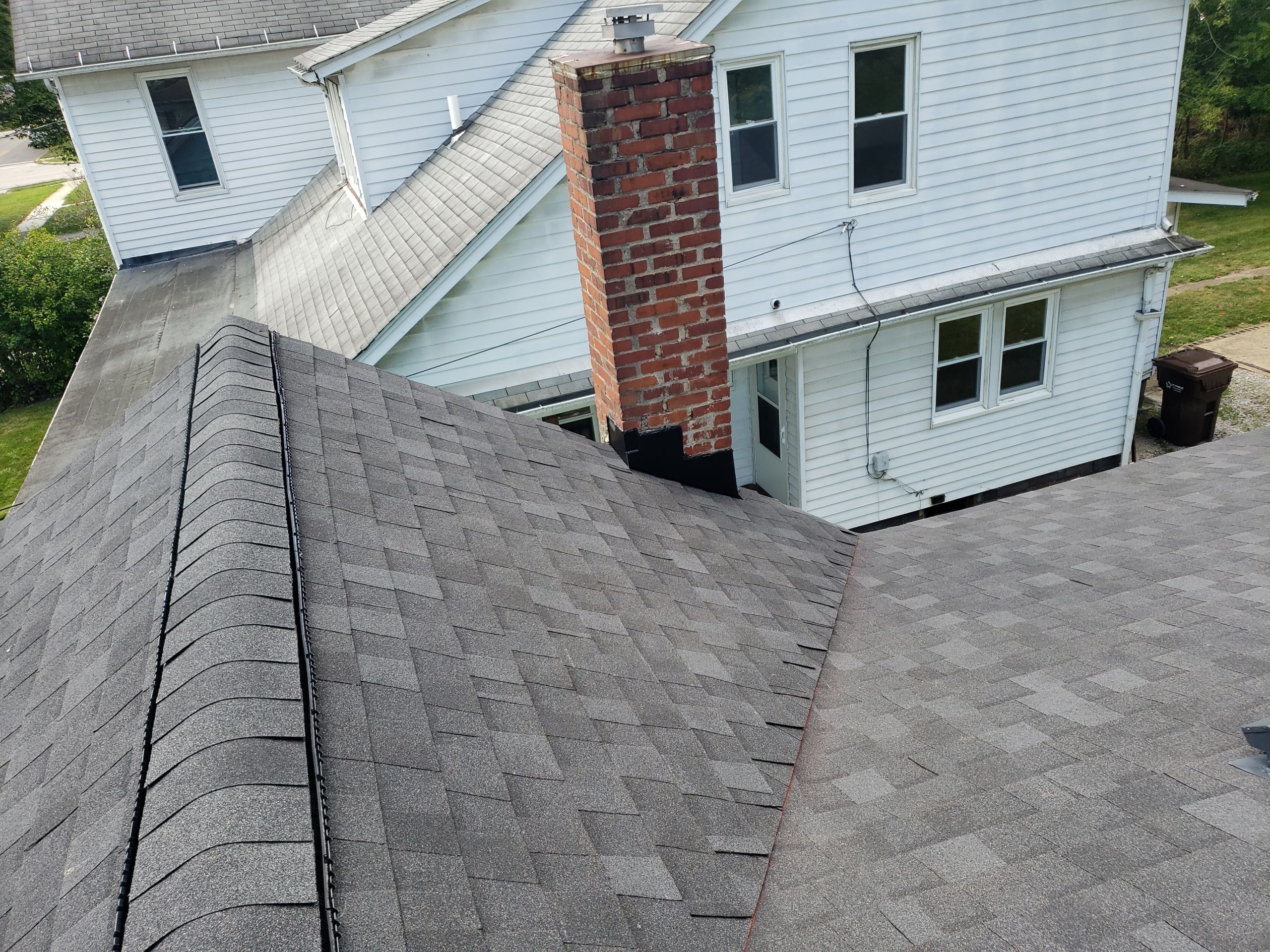 ATLAS PINNACLE COLOR: PRISTINE SCHOTCHGARD BLACK SHADOW DRIP EDGE: BLACK by Eagle Eye Roofing