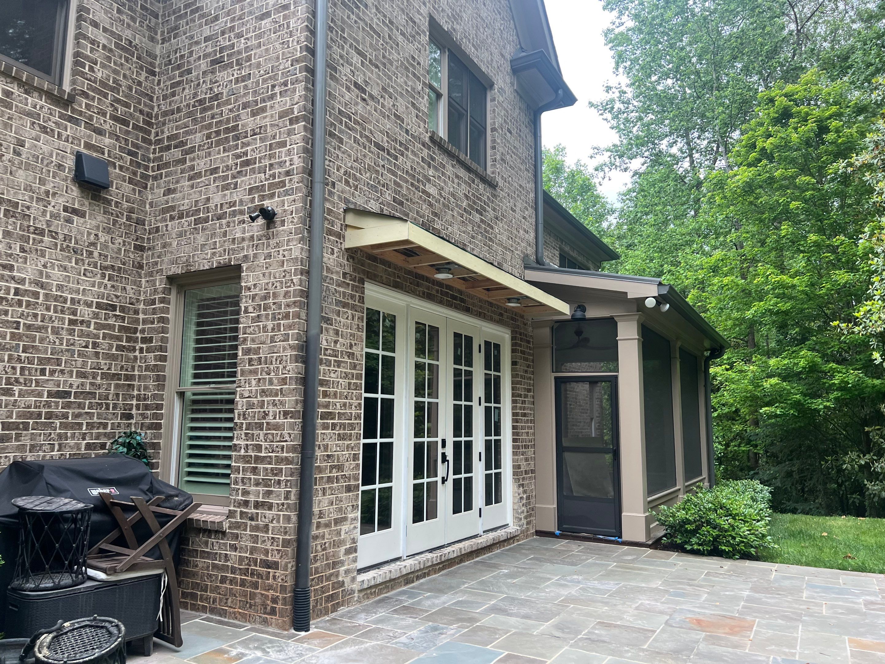 Atlanta French Door Installation with Custom Wood Overhang and Flagstone Patio by Swift Home Renovations