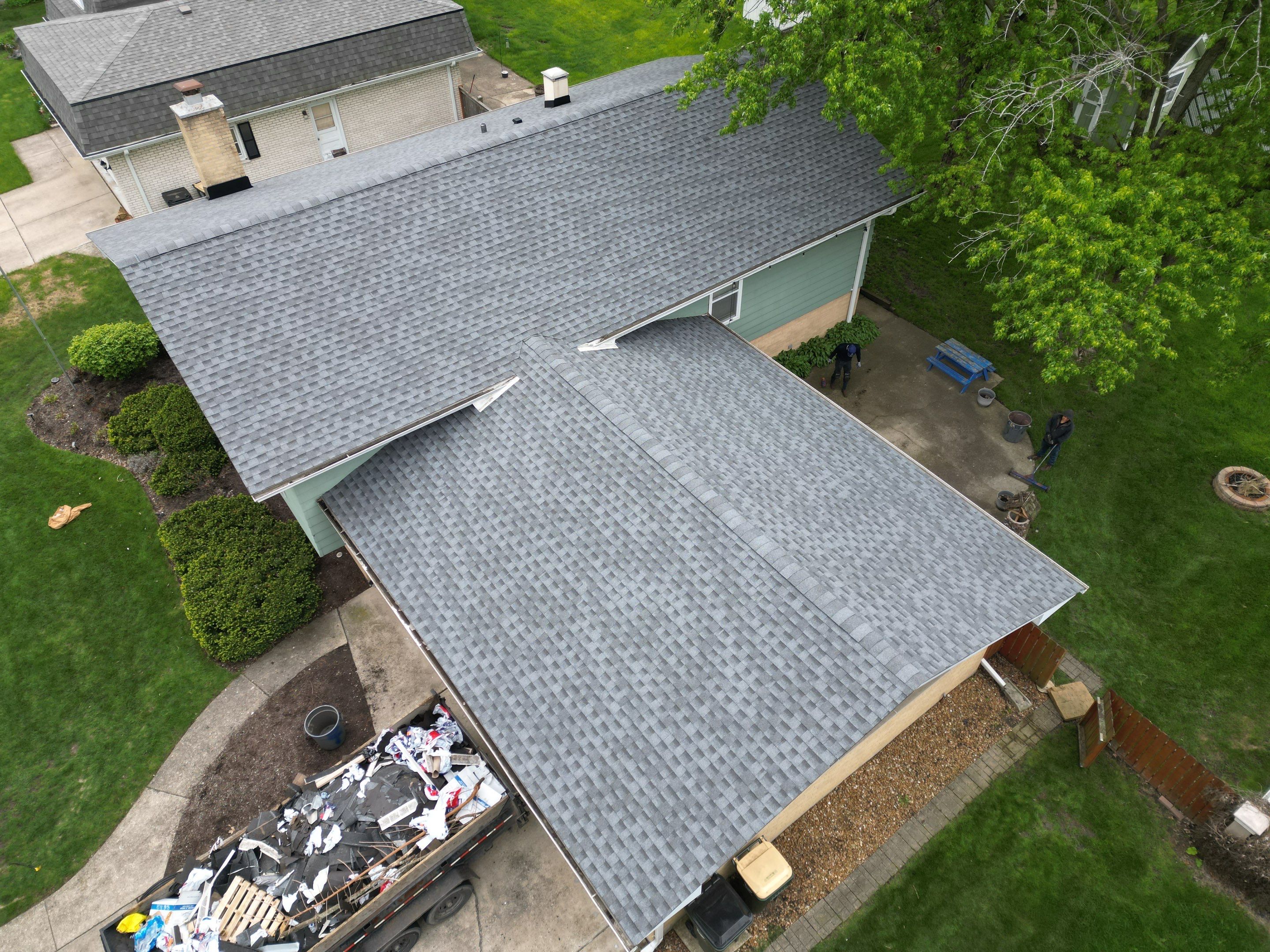Roof replacement and chimney flashing by Optimal Home Improvement 