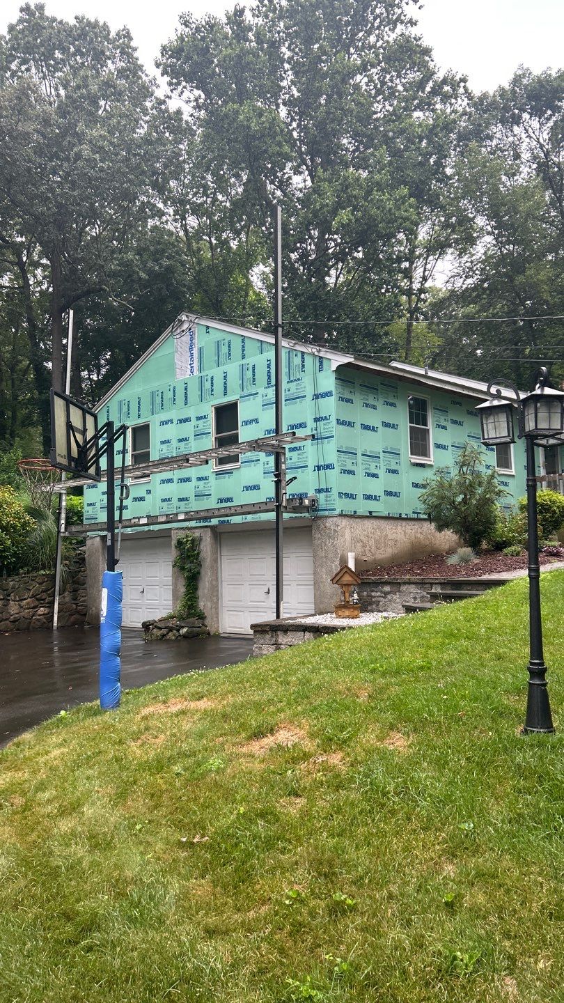 Siding Renewal with Cert Monogram D/4 x 12'6" clapboard, Pacific Blue by DiGiorgi Roofing and Siding Inc