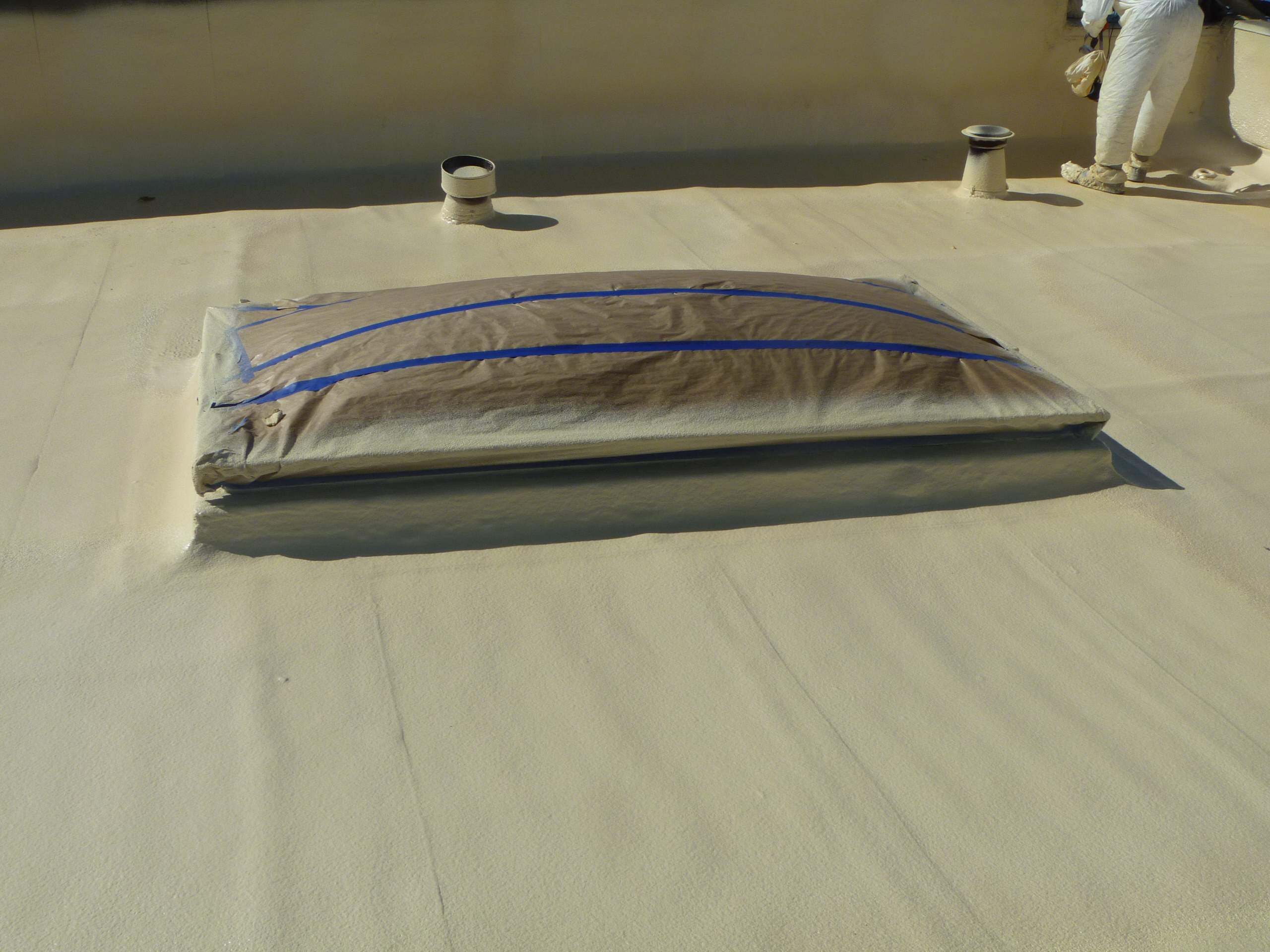 Commercial Roofing Installation using Spray foam and Conklin Benchmark/PUMA XL 18 yr warranty coatings by Straight Edge Roofing Inc