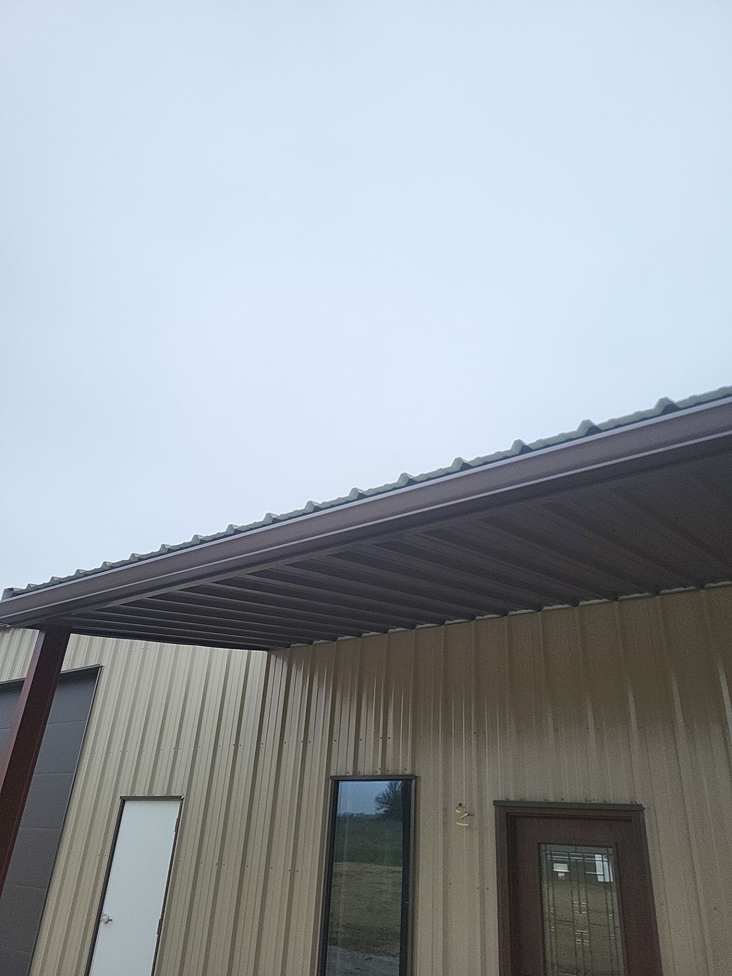 Metal Shop 6" Gutters & Downspouts Install - Color Musket Brown  by Titan Commercial & Residential Roofing 