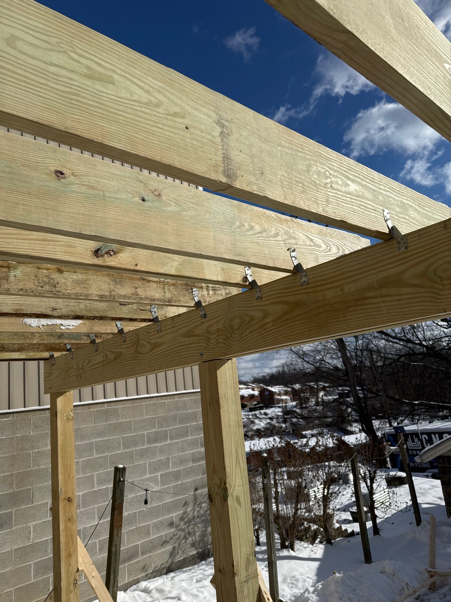 Deck and door by Cousins Roofing Siding & Decks