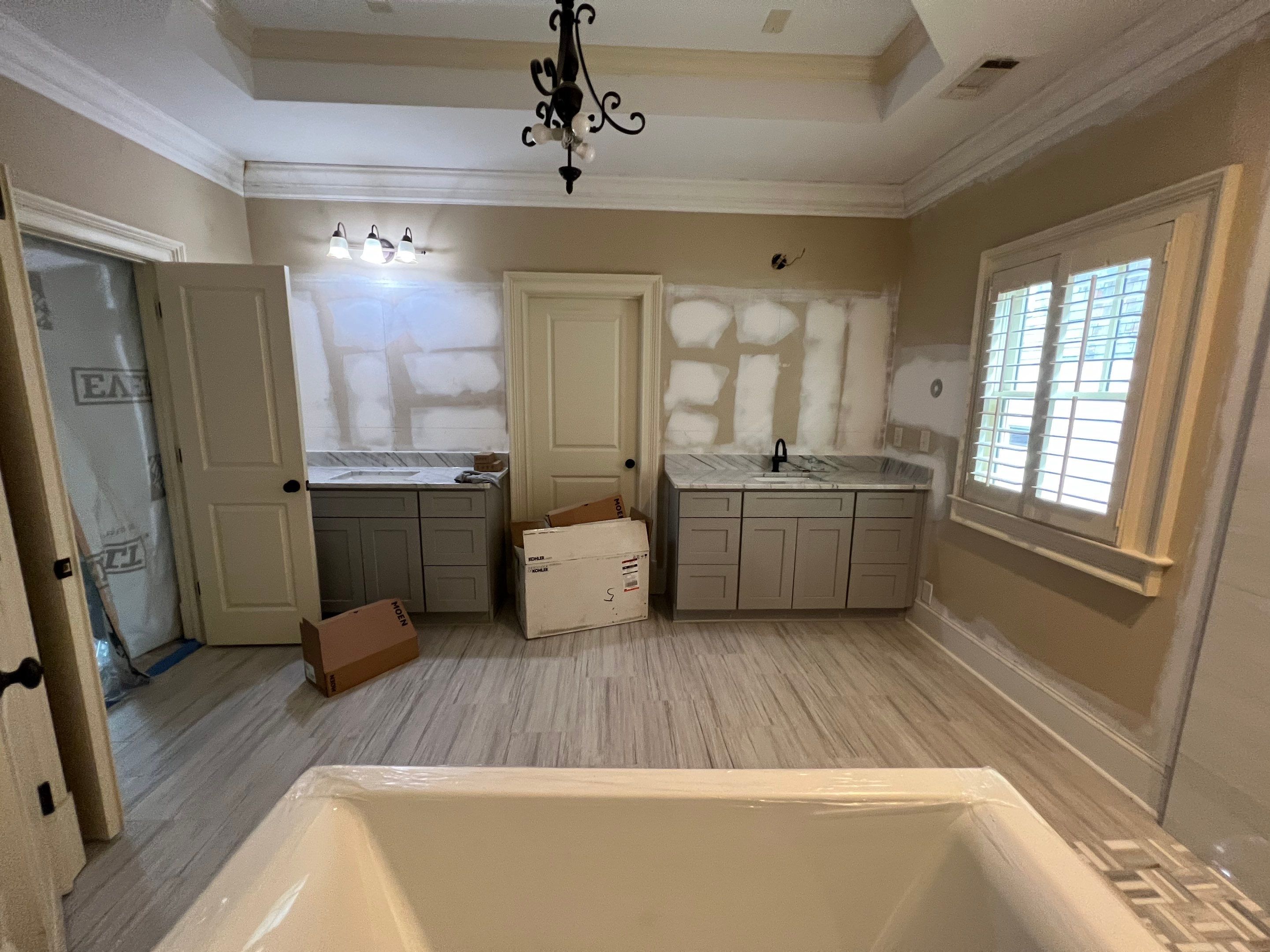 Modern Master Bathroom Renovation With Freestanding Tub in Smyrna by Swift Home Renovations 