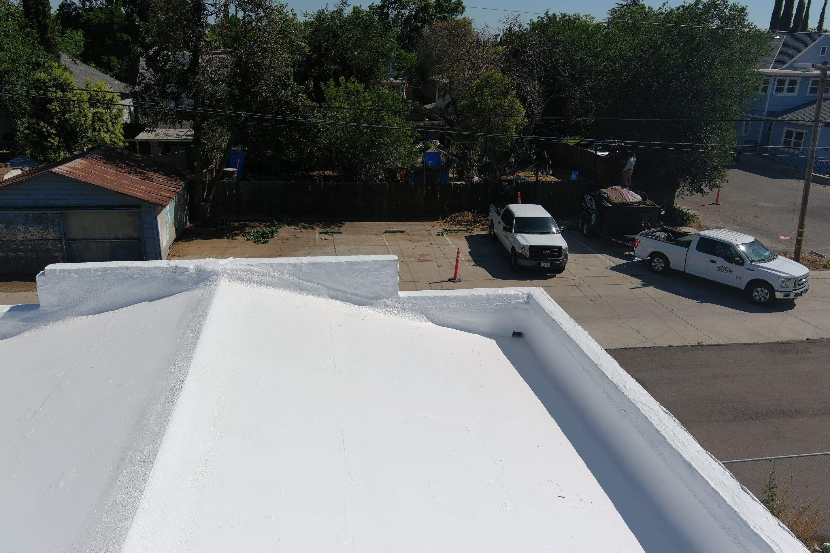 Commercial Roofing Installation using Conklin BenchPly system with PUMA top coat (imbedded fabric system) by Straight Edge Roofing Inc