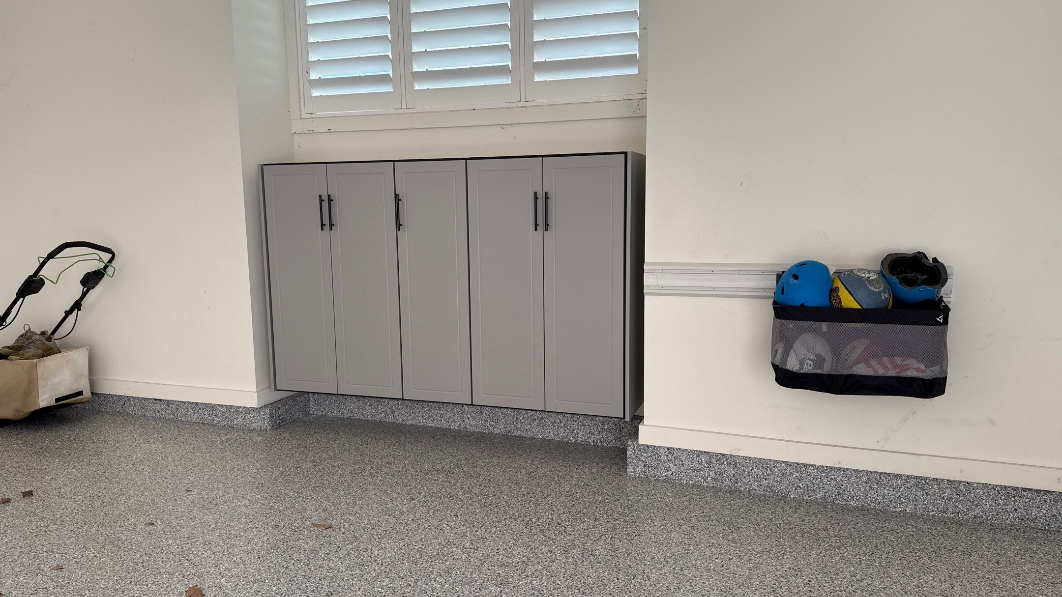 Nick's New Floor & Storage Looks Beautiful by Banner Garage