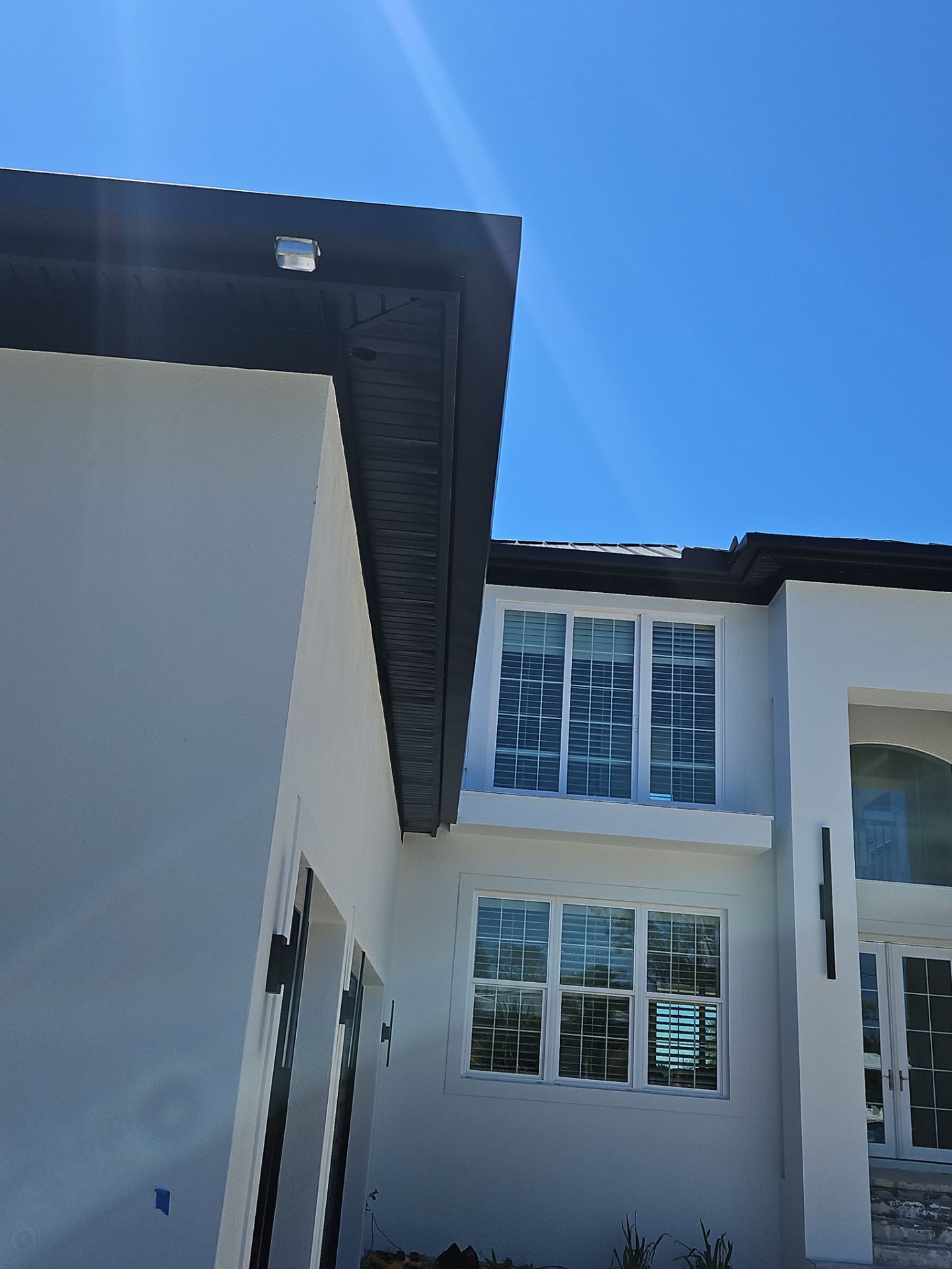 Soffit and Fascia Installation and black seamless gutters in Sarasota FL by Gutter Professors