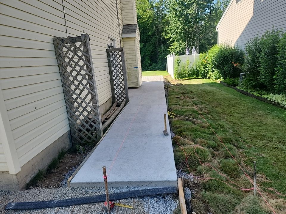 Stamped Concrete, Entry Door, and Concrete  by Ivy Lea Construction
