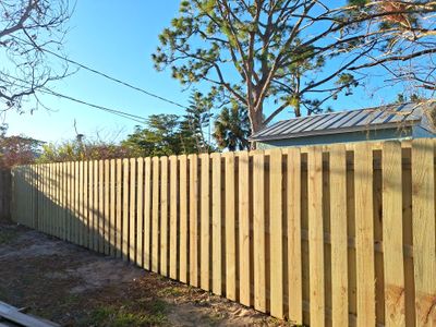 Wood Fence Installation using 6ft Pressure-Treated Wood Board-On-Board Privacy Fence with a 4Ft 3 Rail White Aluminum Fence
