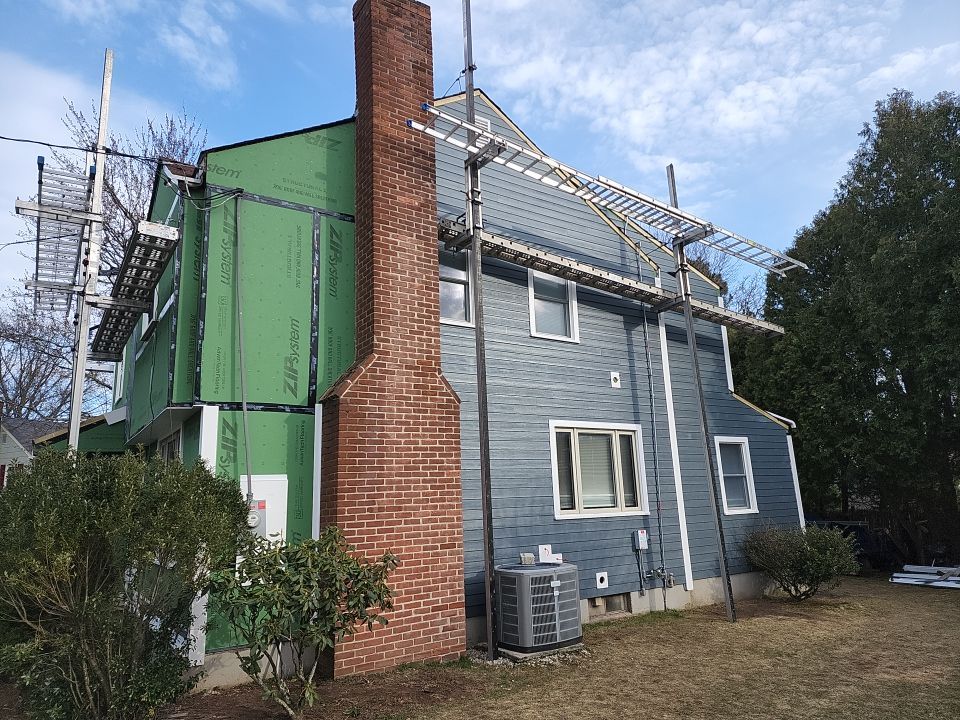 James Hardie siding, new metal roof and couple windows being installed. by UBrothers Construction