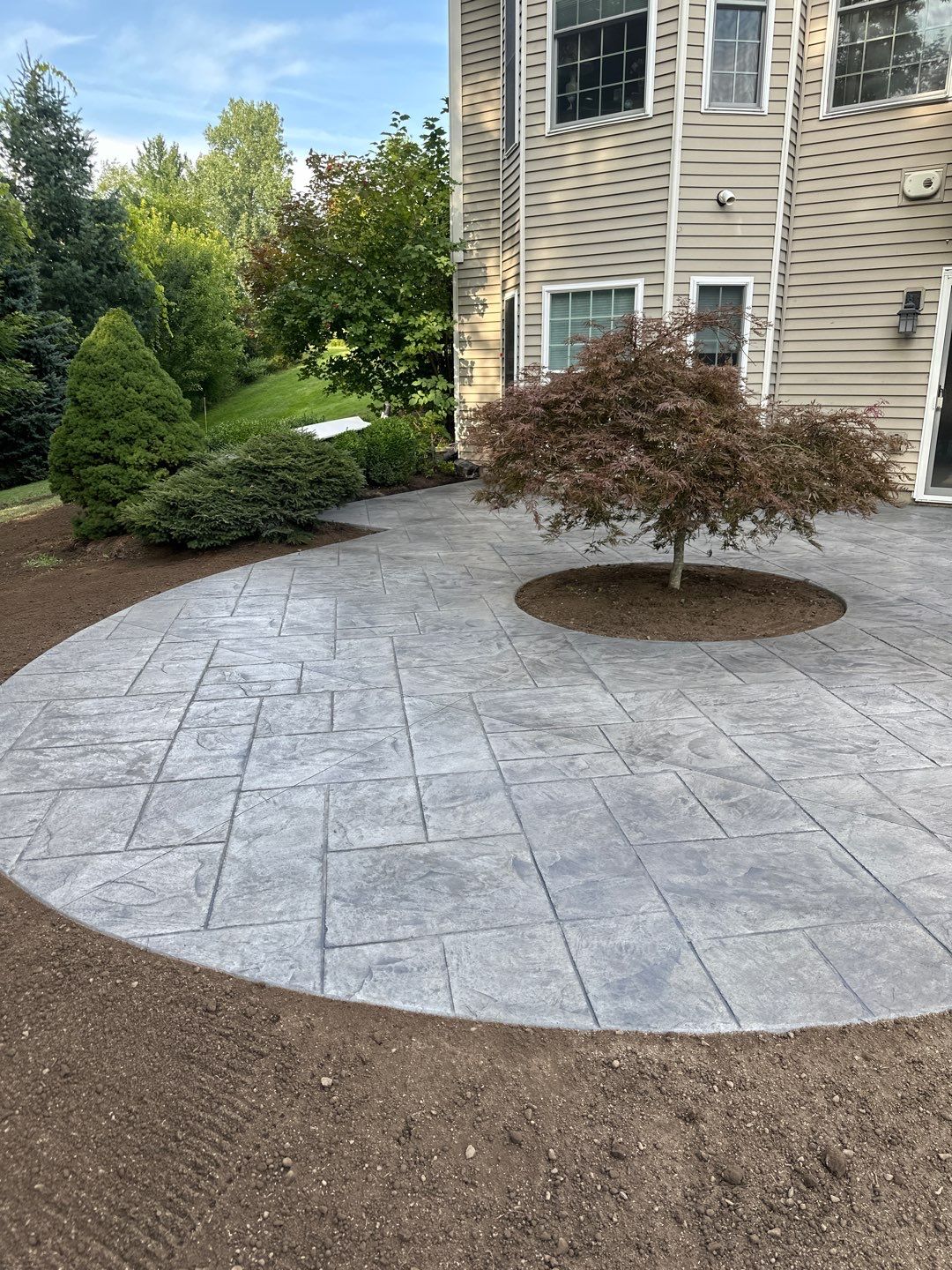 Majestic ashlar stamped concrete patio  by NG Masonry & Construction LLC