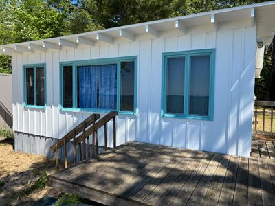 Lakeside Cottage Exterior Painting and Teal Trim Restoration in Mears