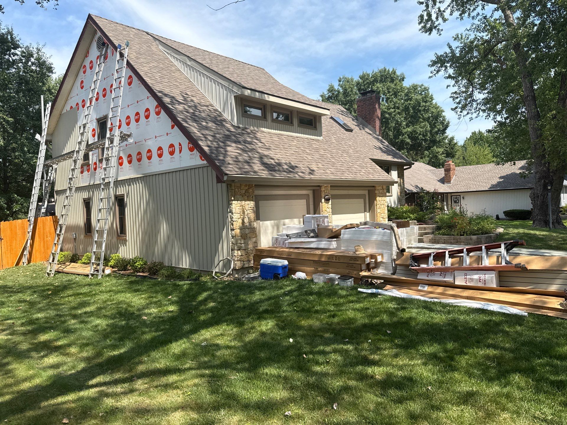 Comprehensive Kansas City Exterior Remodel Featuring Board And Batten Siding by EEC Windows, Siding & Roofing