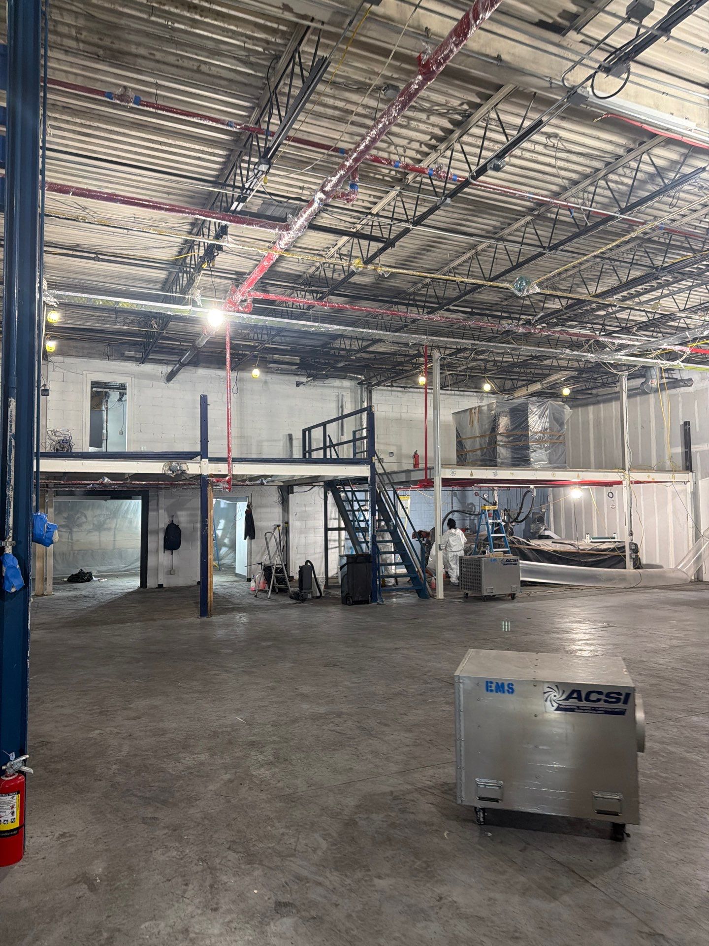 Industrial Warehouse Fire Damage Cleaning and Spray Sealing in Islandia by EMS Restoration Corp