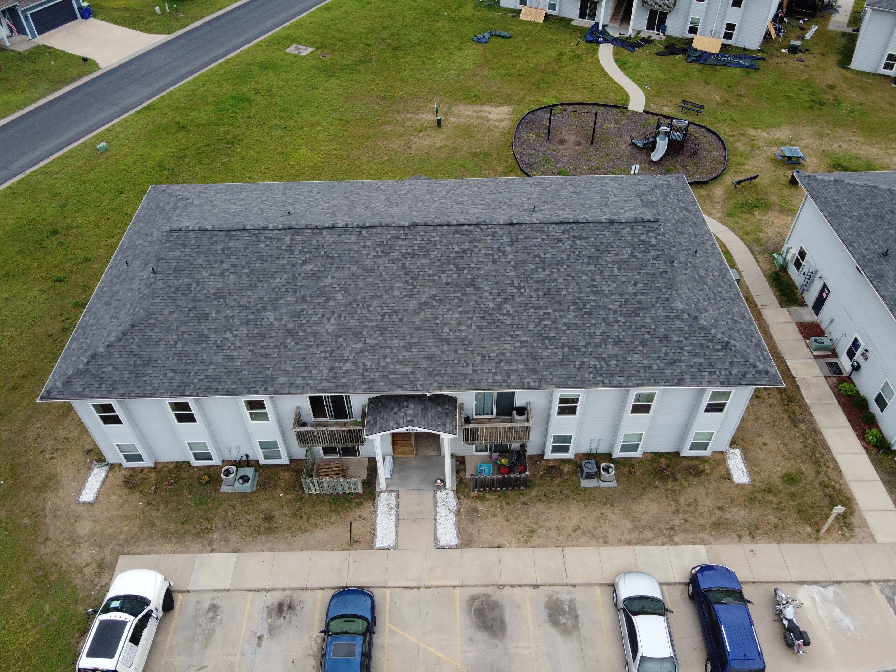 Multifamliy Complex ROOF REPLACEMNT with Ventilation Upgrades using Malarkey Vista Class III IR Shingles by Gorilla Exteriors Contracting, LLC