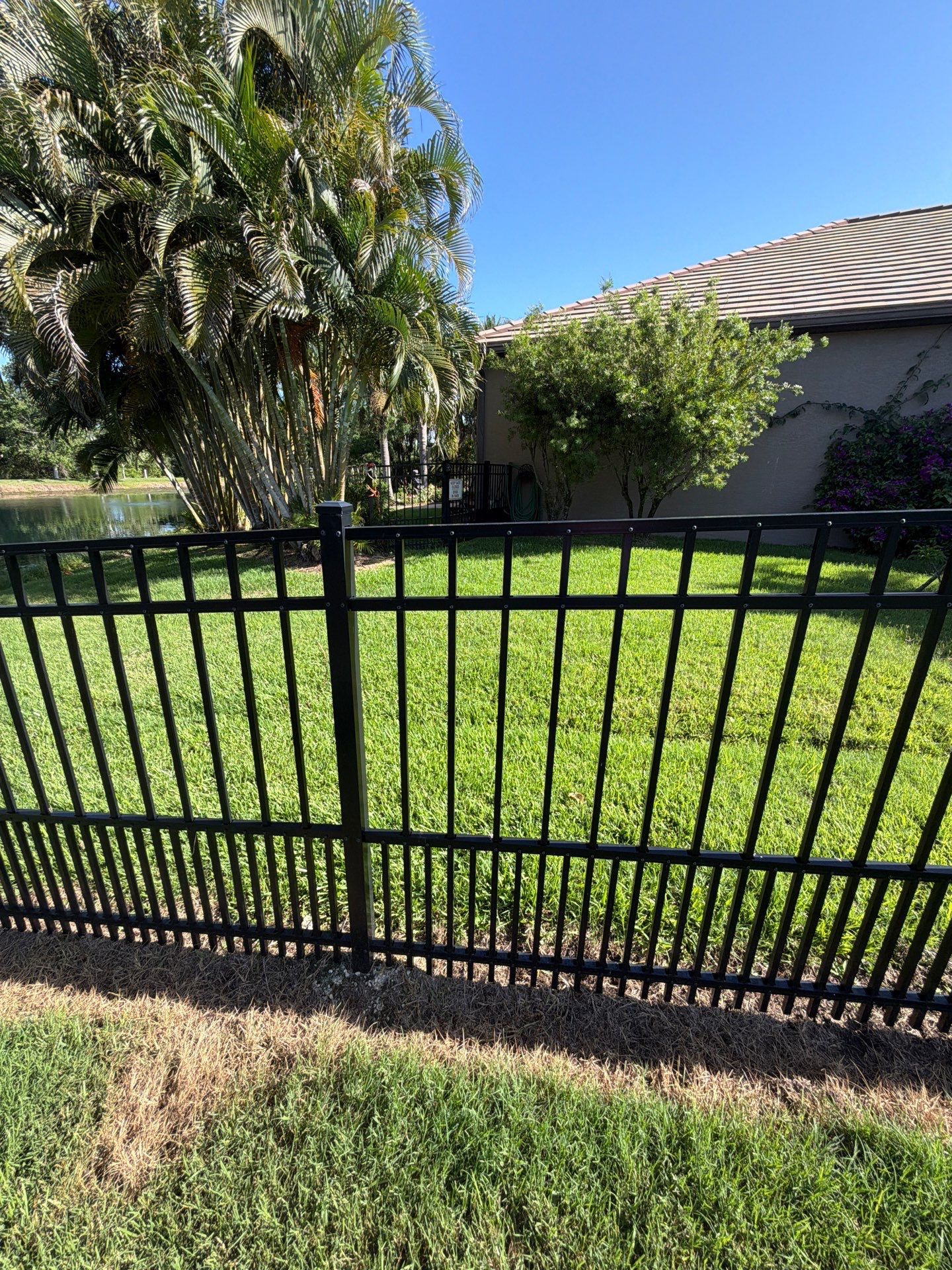 customer with puppy picket aluminum  by H&Y Fence