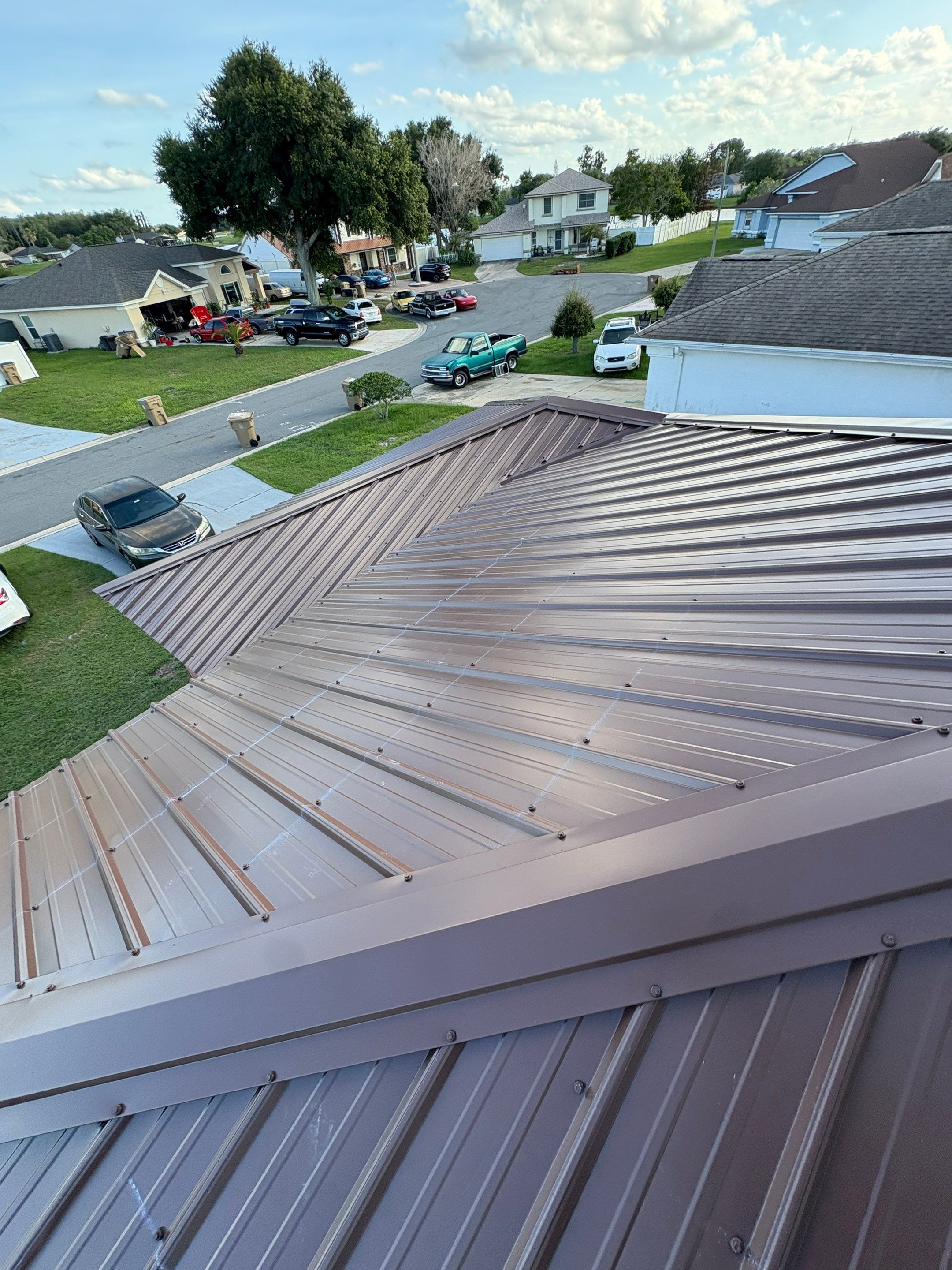 Residential Metal Roofing Installation and Gutter Replacement in Kissimmee by Pinnacle Roofing Group