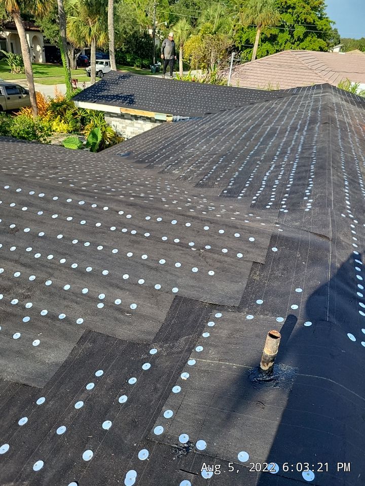 Residential Roofing Installation using 1" Nail strip metal roof by BLUES BROTHERS CONSTRUCTION CORP