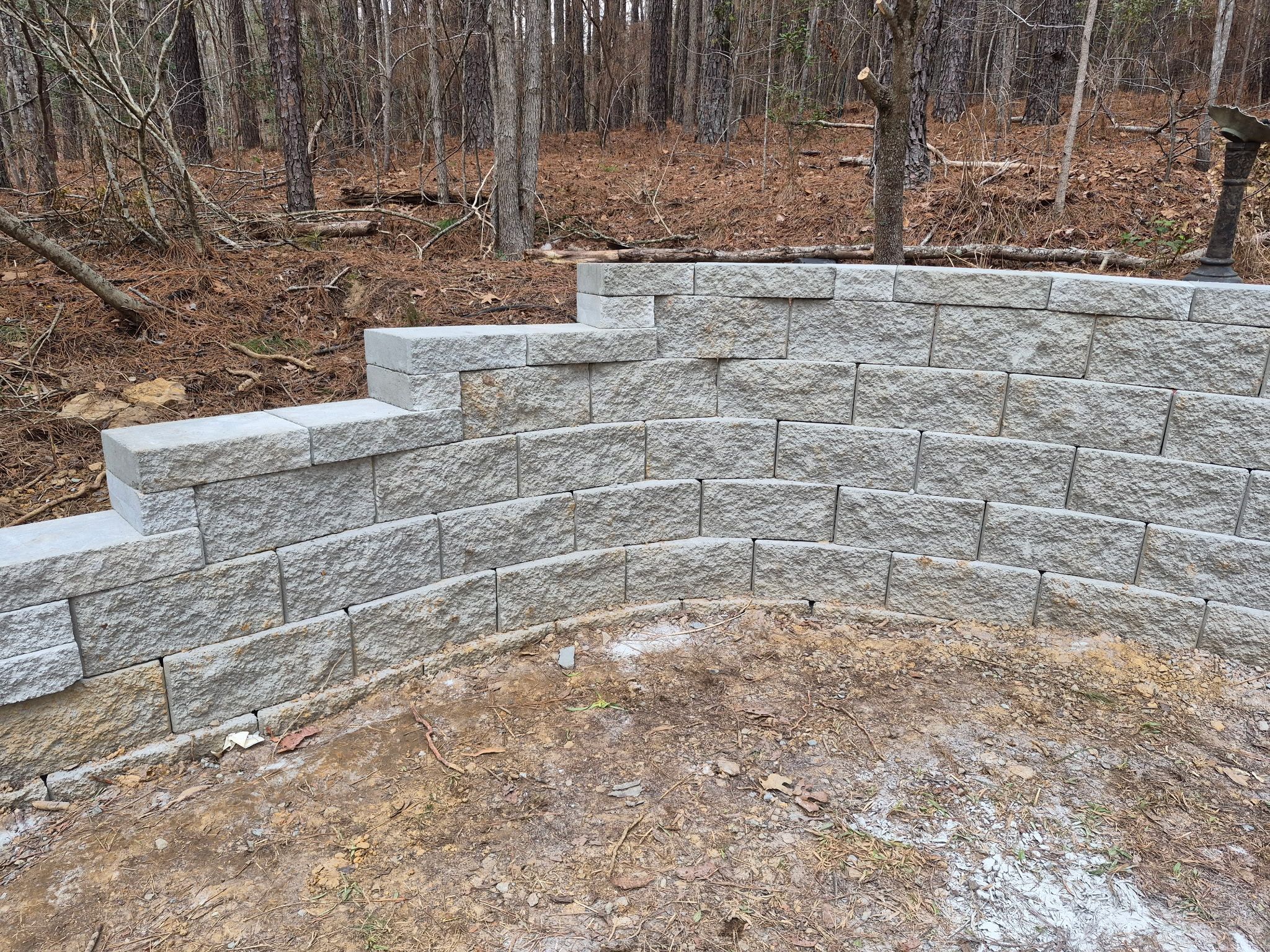 Pittsboro Outdoor Living Transformation – Retaining Wall, Paver Patio & Elevated Deck by Elite Remodeling and Design LLC