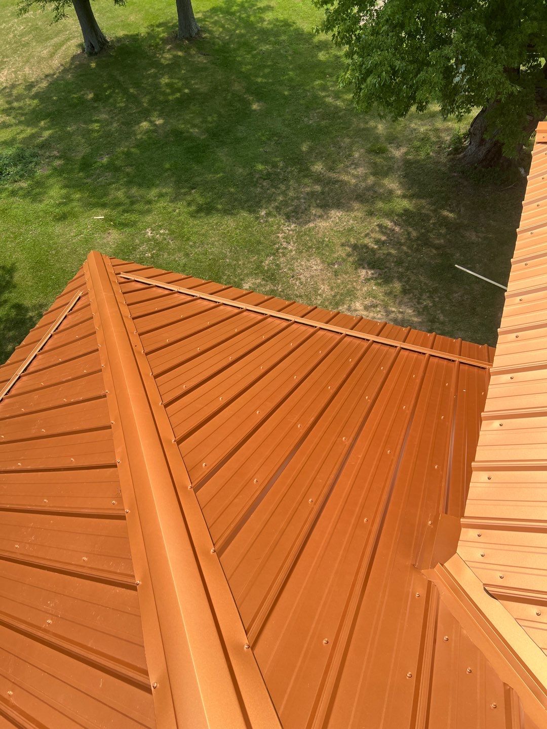 Residential Roofing Installation using Performance Panel Metal - Copper Metallic by RoofX 