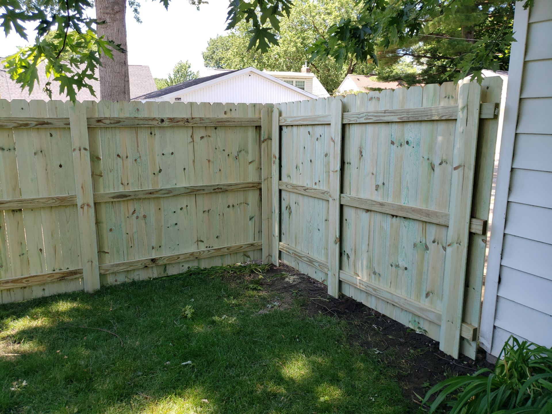 Pressure-Treated Pine Privacy Fence Replacement in Waterloo, Iowa by Perfect Picket Fence and Stain