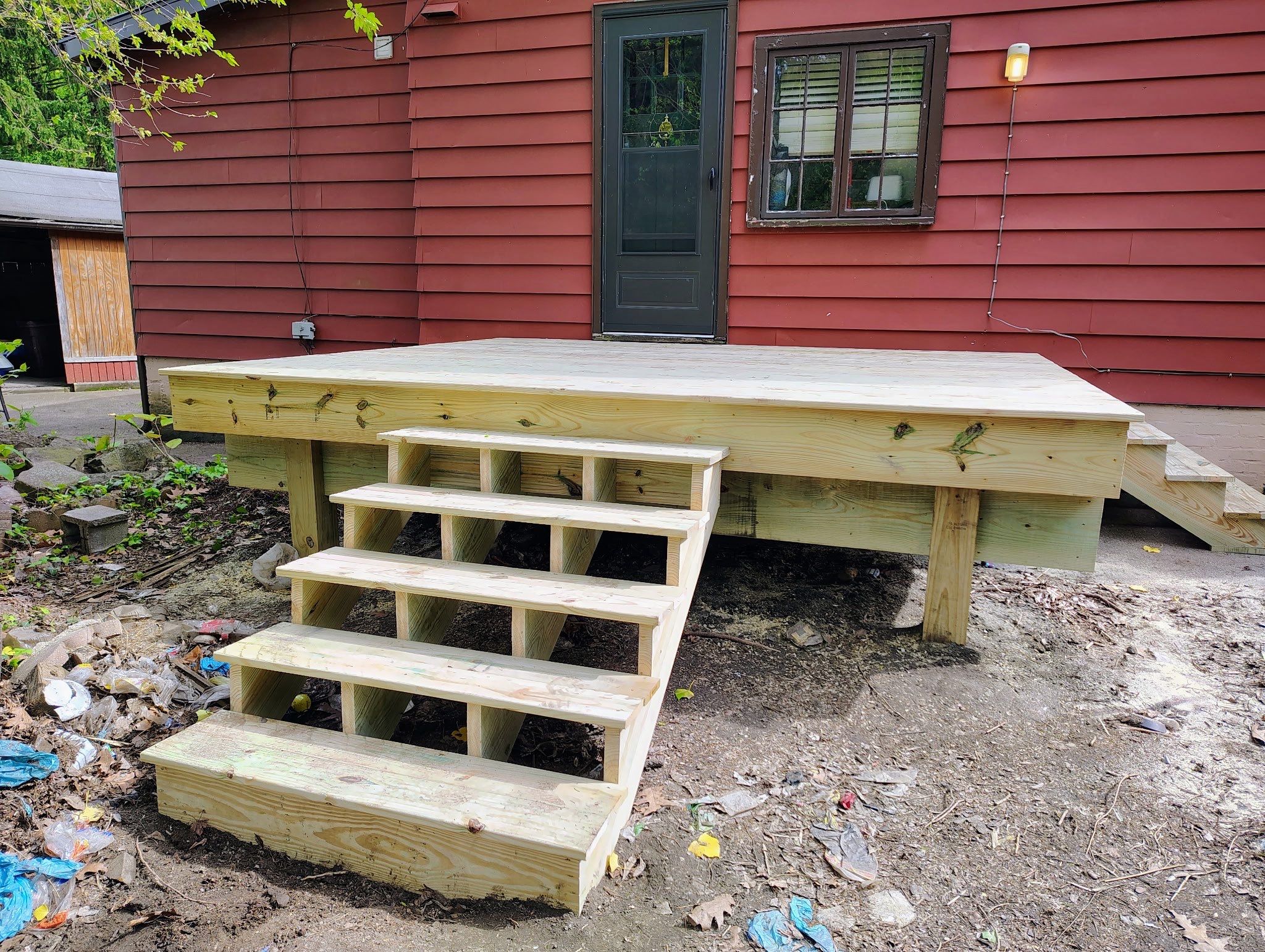 Roof sunspace deck  by Cousins Roofing Siding & Decks