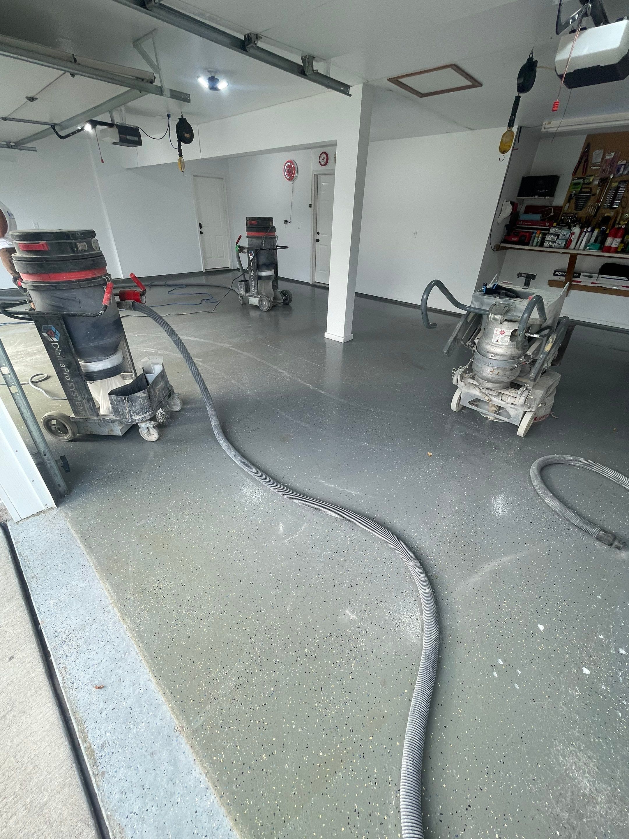 Multi-Car Garage Concrete Coating with Coyote Flake Finish in Sioux Falls by Select Painting, Coatings & Garage Cabinets