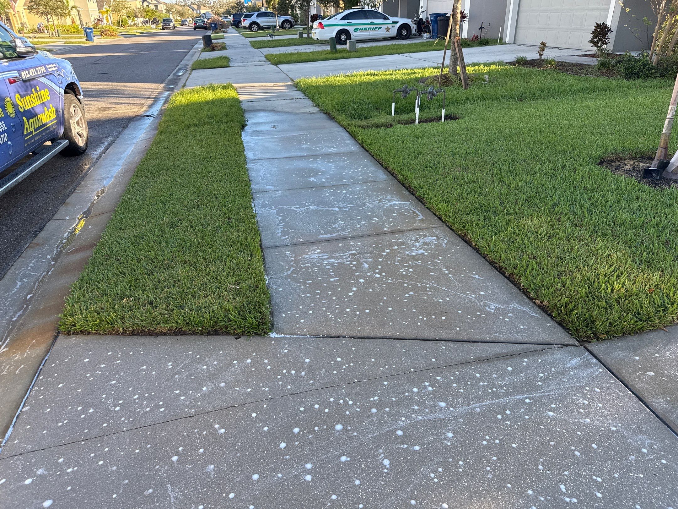 Concrete Driveway, Sidewalk, Street Curbing, and Entryway Cleaning in Willow Walk Community, Palmetto, FL by Sunshine AquaWash
