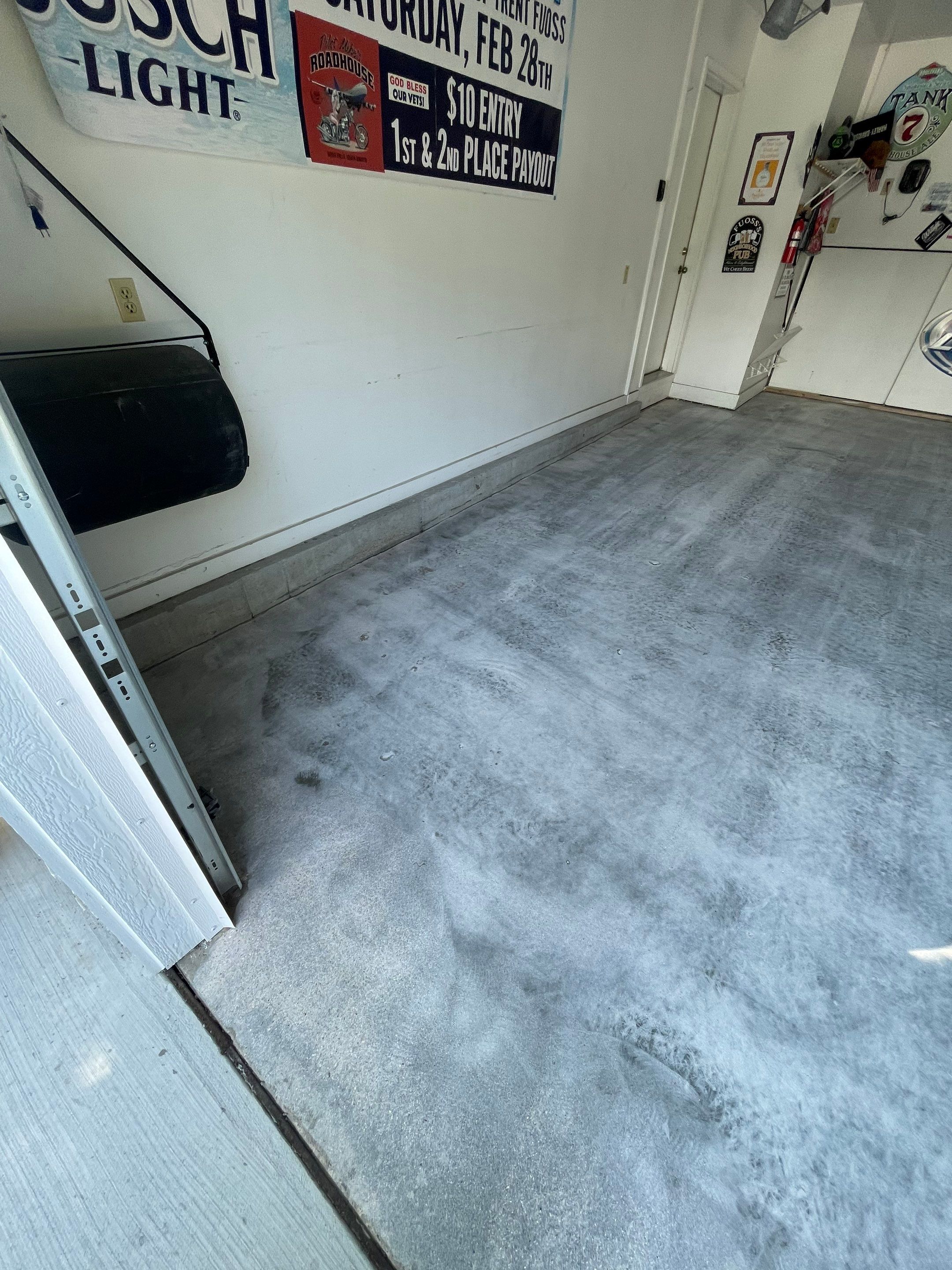 Residential Garage Floor Coating with Feather Grey Finish in Sioux Falls by Select Painting, Coatings & Garage Cabinets