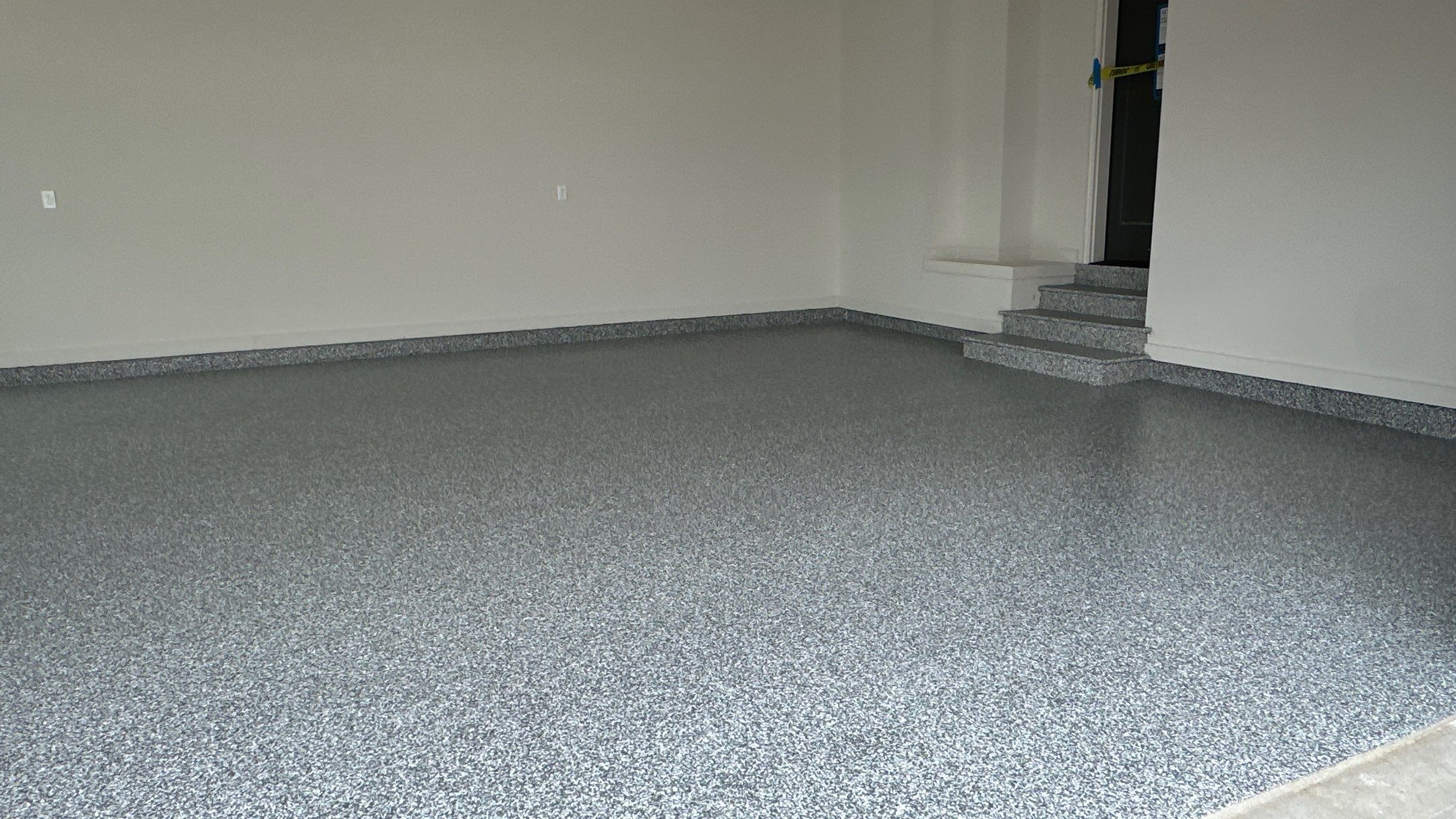 Check out how beautiful a brand new stonehenge flake floor looks by Banner Garage
