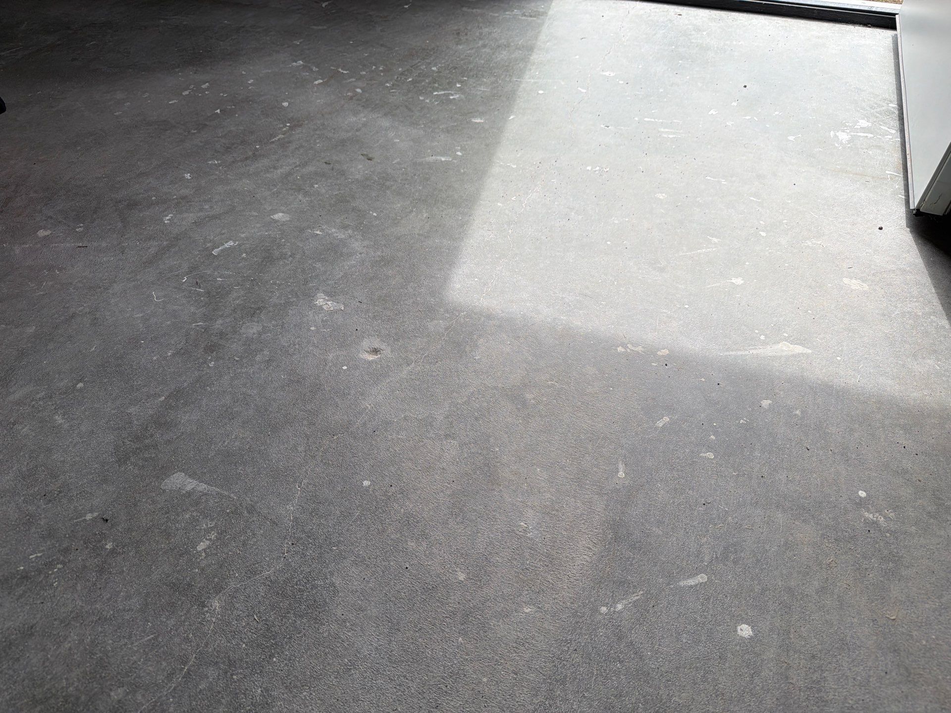 Decorative Chip Concrete Coating Installation in Luverne by Select Painting, Coatings & Garage Cabinets