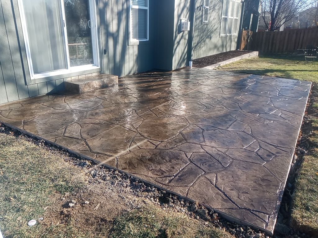 Back Yard Stamped Patio and Pergola by LAND ESCAPES LLC