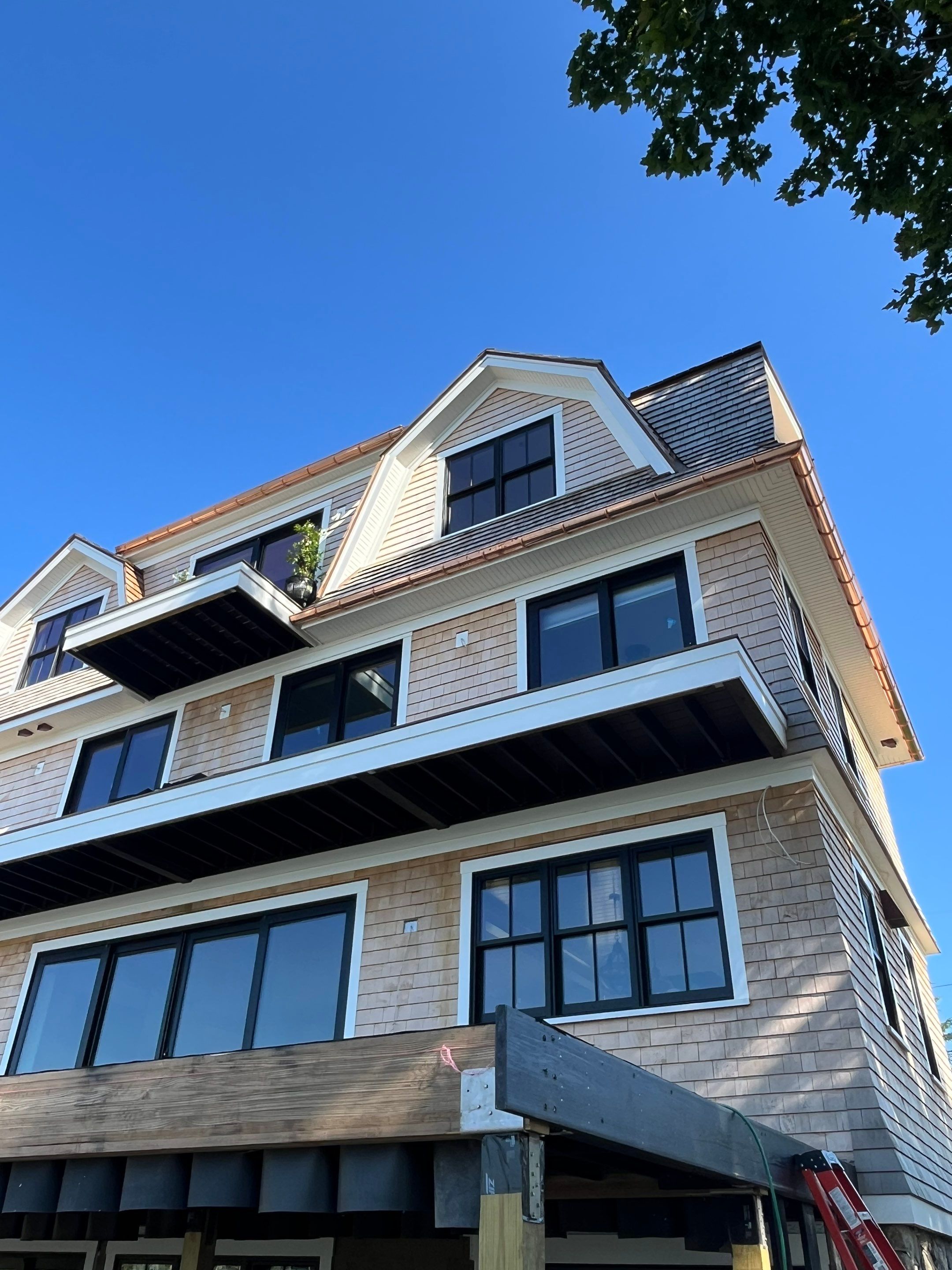 Great Island - Red Cedar Roofing, Yellow Cedar Siding, Standing Seam Copper, & Copper Gutters by Rinaldi Brothers